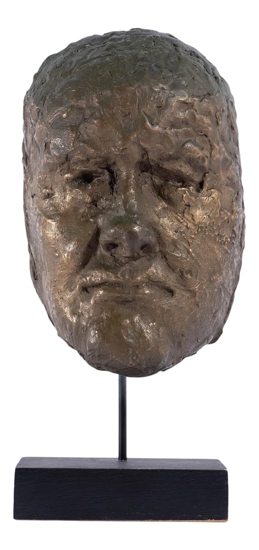 Abstract Bronze Sculpture of a Face: A mid-century abstract sculpture of a face. Composed of bronze, the Brutalist style sculpture forms a mask-like shape with masculine facial features and rests upon a metal and wood base. Condition: