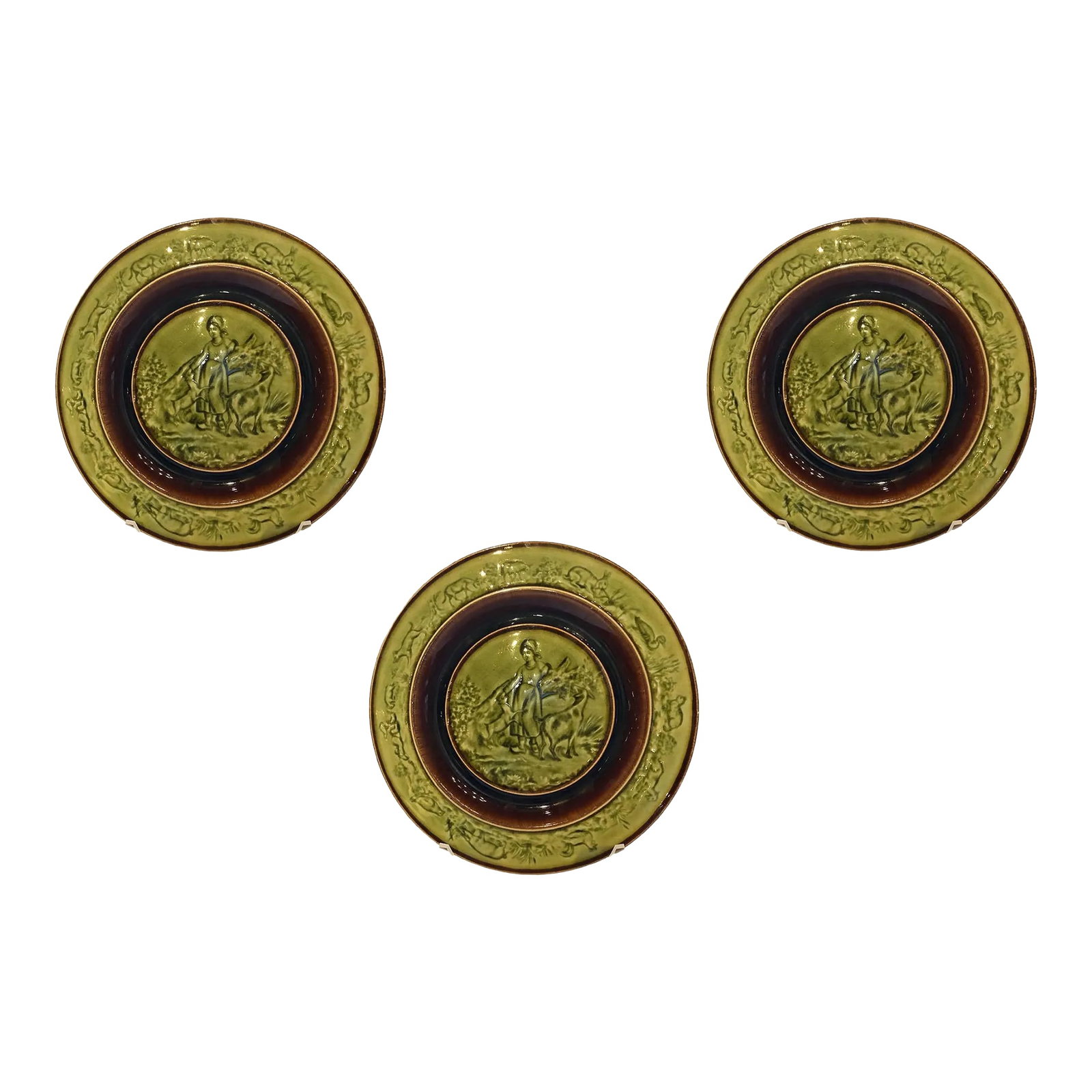 Vintage Bordallo Pinheiro Majolica Plates - Set of Three: A set of three glazed Bordallo Pinheiro majolica plates. With female and animals. Bordallo Pinheiro (1846-1905), Portugal. Condition: Alterations: Original Condition Unaltered Imperfections: Some Impe