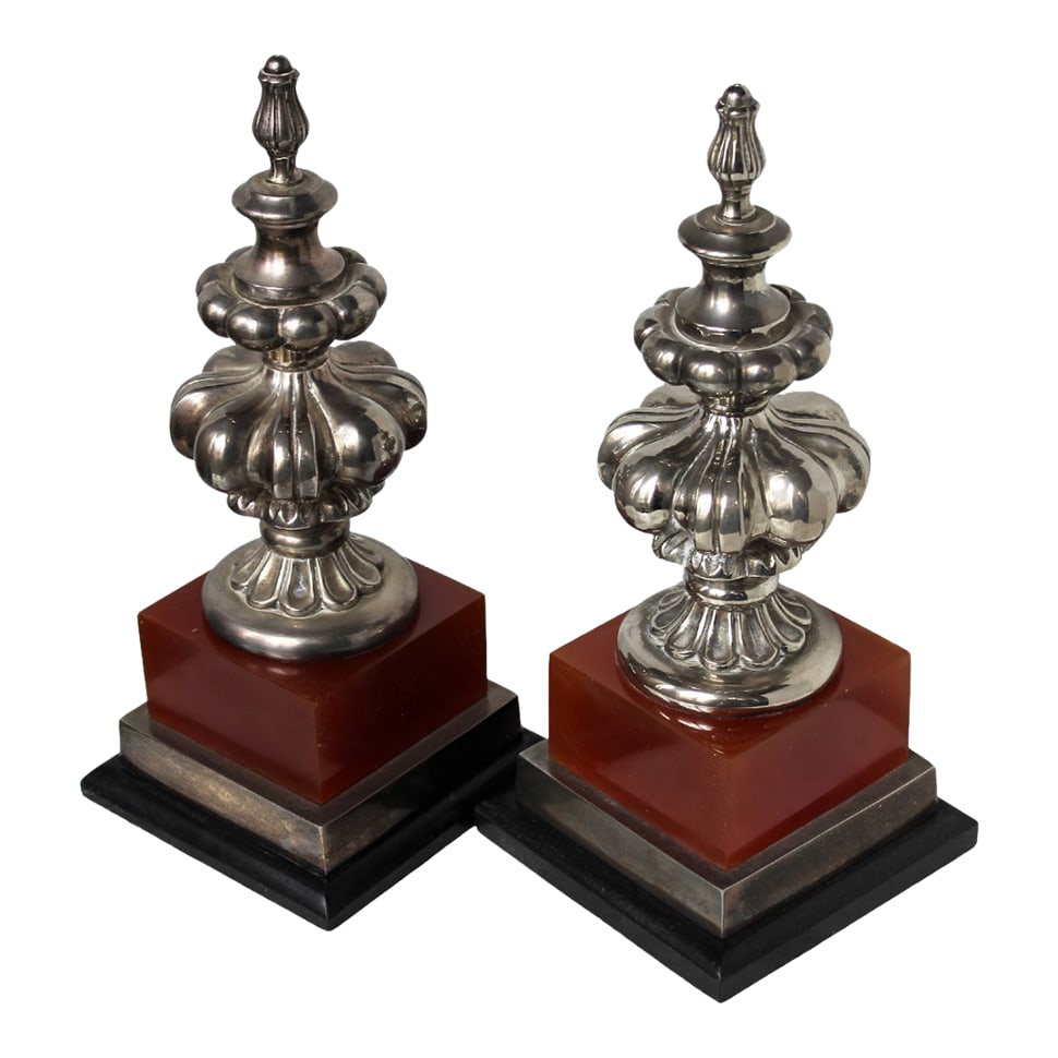 Bombay Company Obelisks - a Pair: Stunning pair of obelisks with silver-plated elements with oxblood red and wood bases. Signed Bombay Company. Sold as a pair. Lined on the bottom with felt to protect your furniture. Great in an