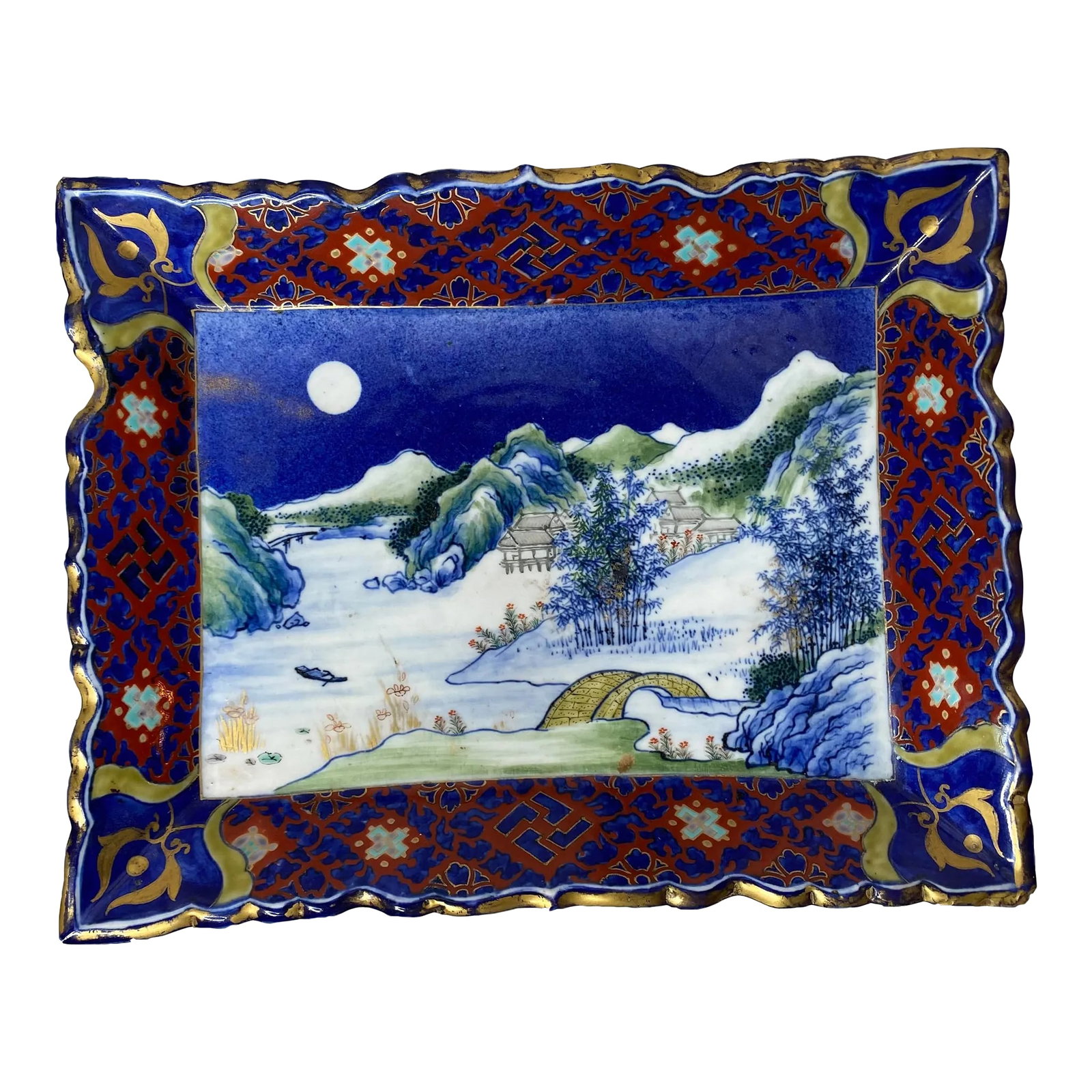 Antique Japanese Imari Ceramic Dish: Unusual and quite lovely hand painted signed Japanese Imari style tray. Piece has the traditional Imari coloration with cobalt, iron oxide red, white, green and turquoise with gold highlights used to 