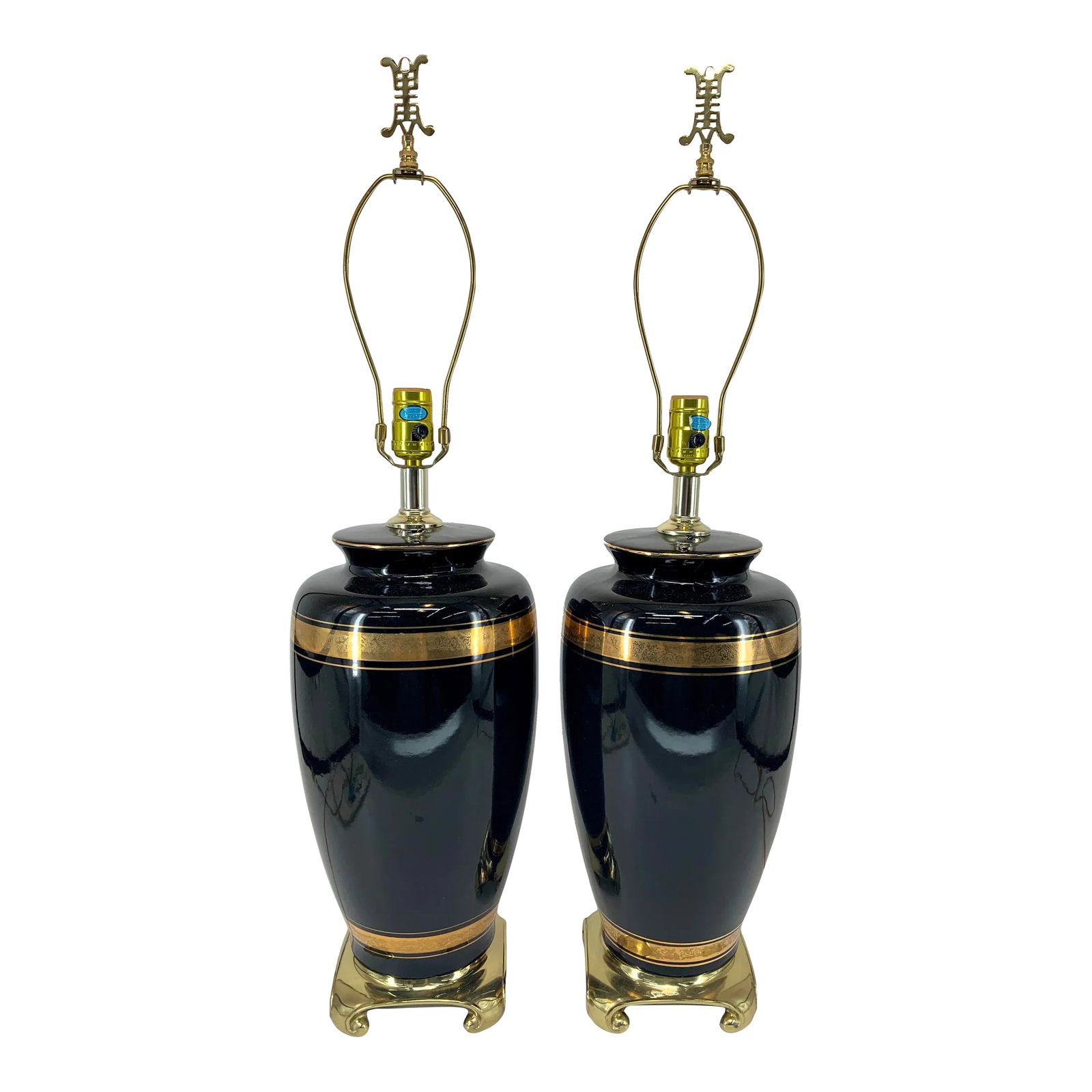 Pair of Vintage Black and Gold Asian Style Ceramic Lamps by Alsy.: Pair of large shiny black ceramic table lamps by Alsy . Embossed gold bands, polished brass bases , Asian style original brass finials . Beautiful lamps in perfect condition .21.5" to the top of the s
