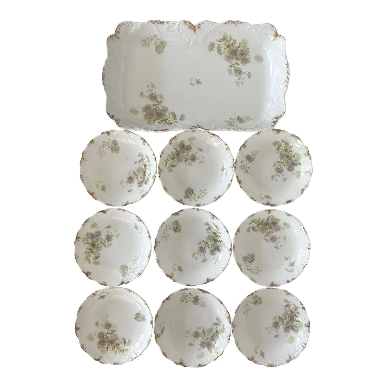 Porcelain Floral Berry Set - Set of 10: Delicate floral design in lilac purple and greens with gold accents define this lovely Porcelain Antique Set imported by Lewis, Straus and Sons. The marking indicates that it was imported somewhere