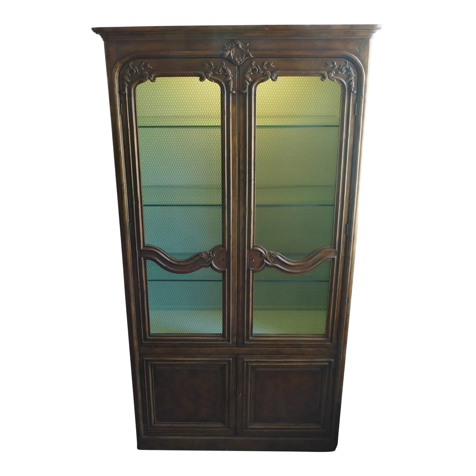 Mid 20th Century French Provincial Display Cabinet Wire Doors by Baker: Vintage Baker French Provincial Display. This carved wood cabinet features a finely carved French design, raised side panels on a flat base, and wire front doors on the top. The locking upper case is 