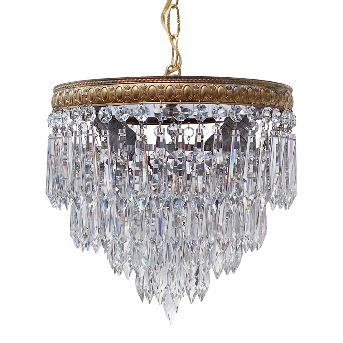 1950s Italian Brass Upside Down Layered Cake Chandelier: Italian layered chandelier with brass rim and 30% leaded U-drop crystal drops. It has 2 Edison base sockets that each can hold up to 100W each. Rewired and restored. #26 Condition: Alterations: