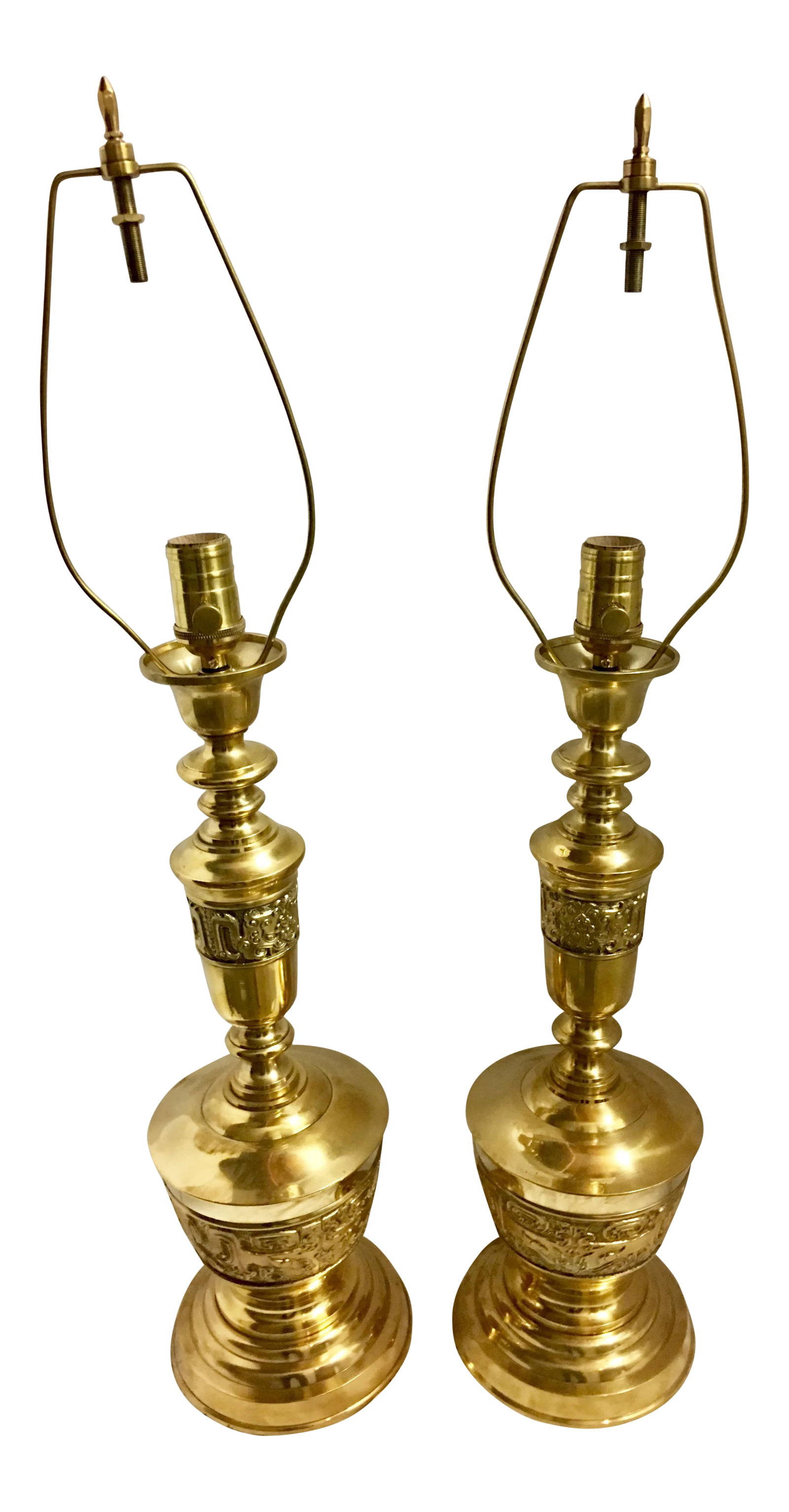 Hollywood Regency Mid-Century Brass Lamps - a Pair: Hollywood Regency mid century brass lamps with intricate design detail on the body, a pair. These were recently re-wired and professionally polished they are in excellent condition! And Beautiful in