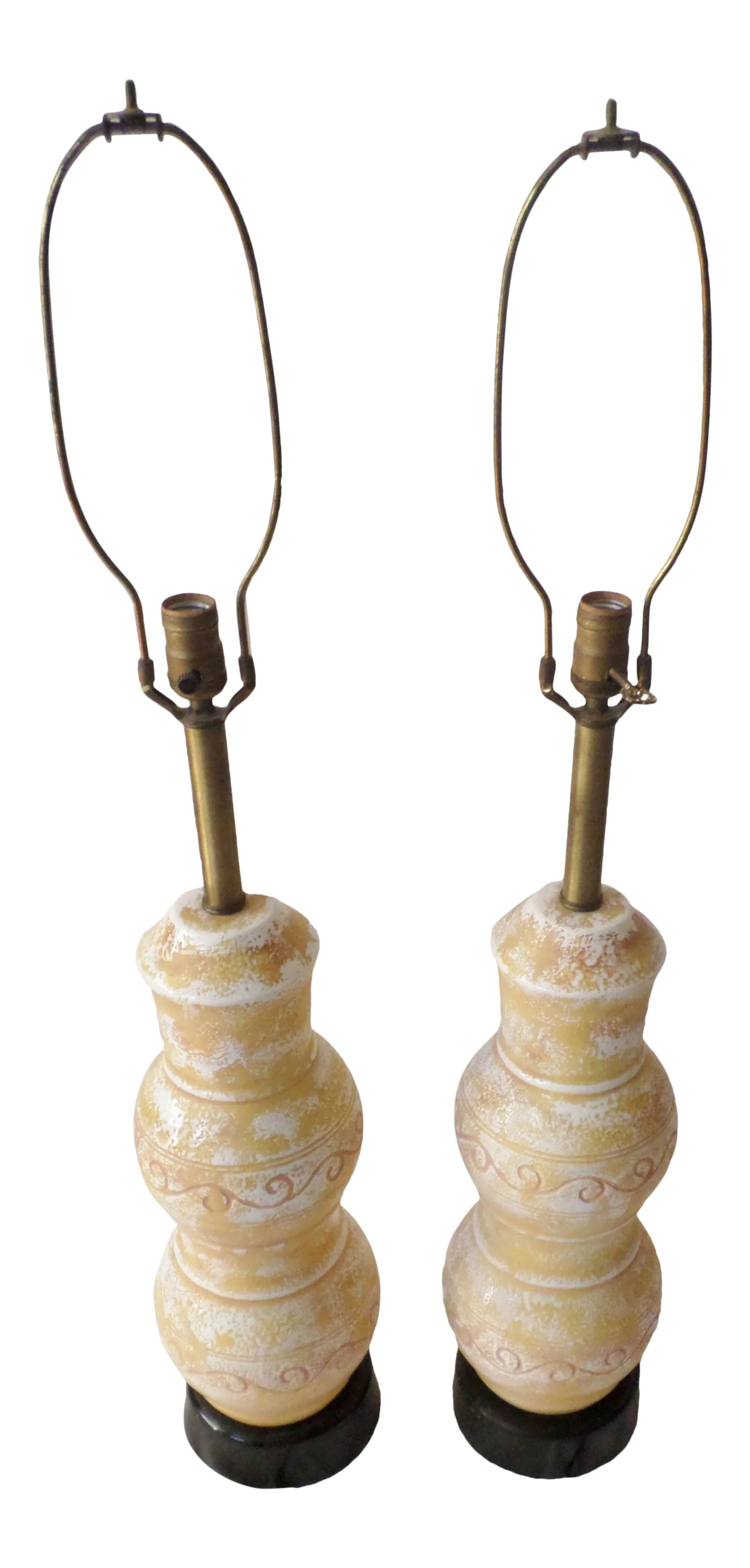 Mid Century Modern Ceramic Table Lamps Yellow and White - a Pair: This is a Pair of Mid - Century Modern Ceramic Table Lamps that are Yellow and White with a Light Peach Accent that are 29" tall and 32.5" tall with halo and 7.5" wide at base and would be wider at th