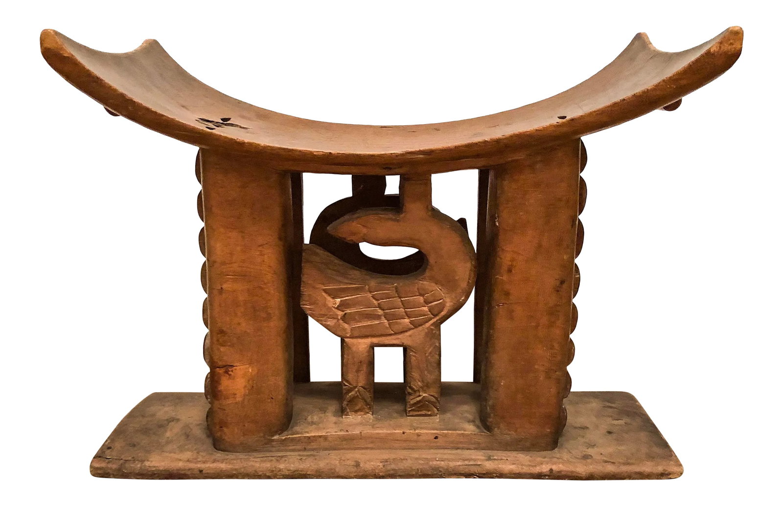 1950s Vintage Wood Carved Ashanti Stool: This wood carved Ashanti stool features a scoop seat and decorative carving detail on the body of the stool. Great way to add a well traveled or collected feel to your space. Condition: Alterations: