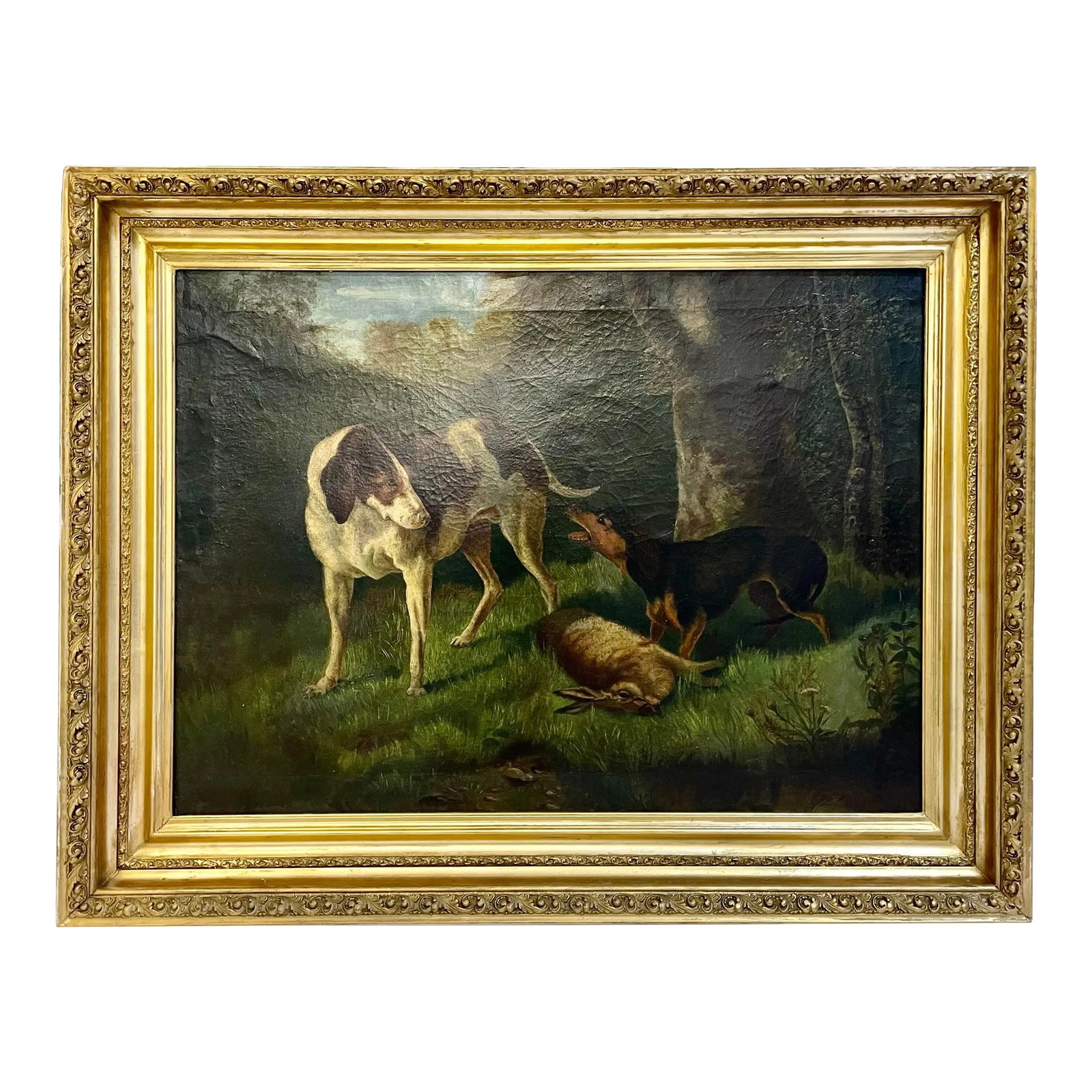 Antique Hunt Scene Dogs in the Forest Painting: Antique dogs on a hunt in the woods oil painting with carved ornate gilt-wood frame. This handsome piece depicts a smaller dog protecting its rabbit prey in the woods. Unsigned. Condition: Alterations