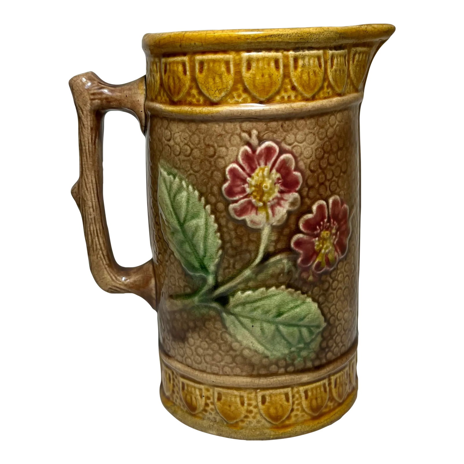 Antique 19th Century Majolica Pitcher / Jug Decorated With Pink Flowers - From the U K: Antique 19th Century Majolica Pitcher / Jug Decorated With Pink Flowers And Twig Handle - From England. There is a hairline crack & small chip near the spout (see photos). Measures 5 1/2" W x 4 3/4" D