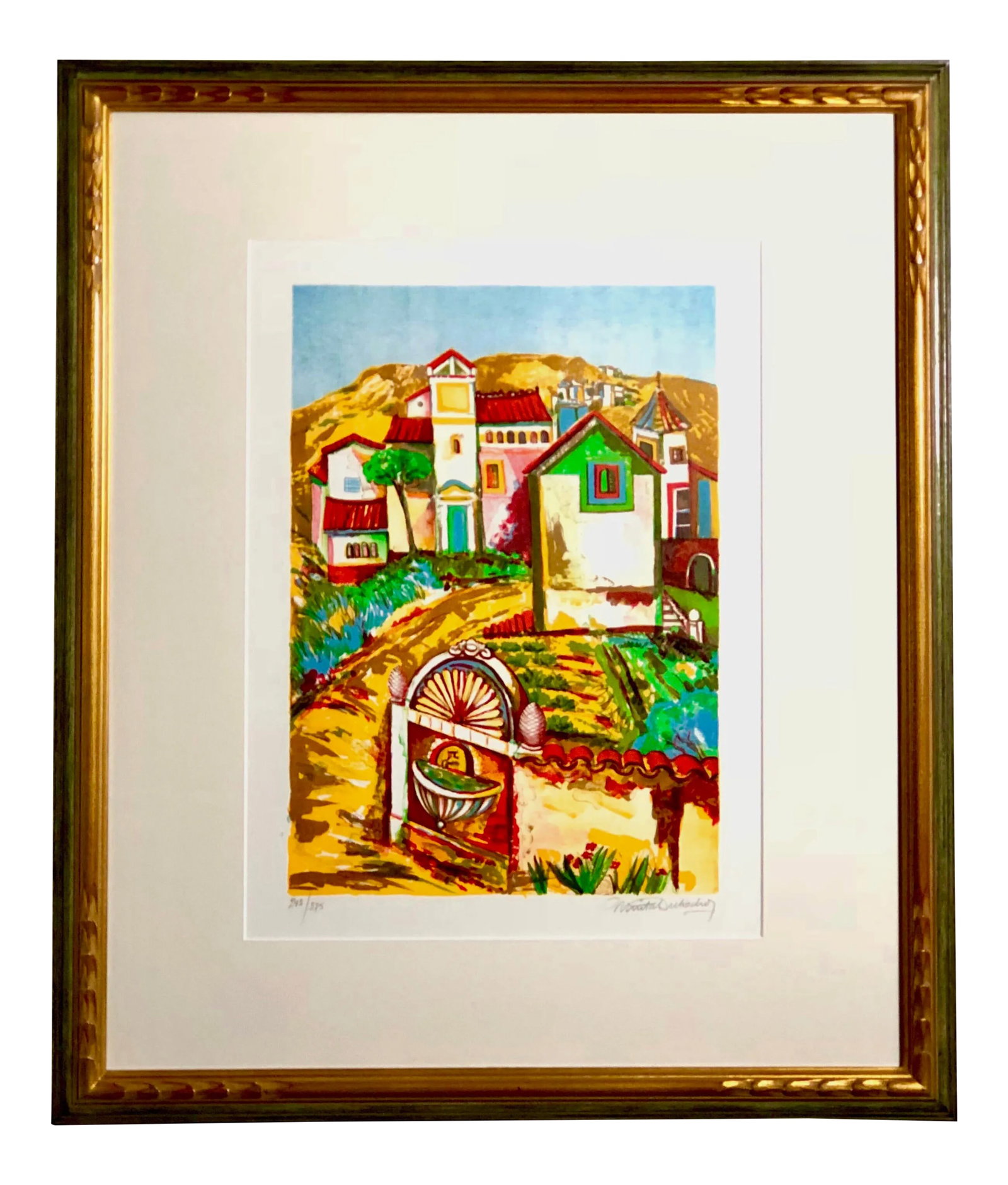 Impressionist Retro Framed Print of a Colonial Town: Midcentury signed and numbered print in bright retro hues of turquoise, red, green, and yellow. The work is in an Impressionist style and shows a road leading past an exterior wall and fountain to a C