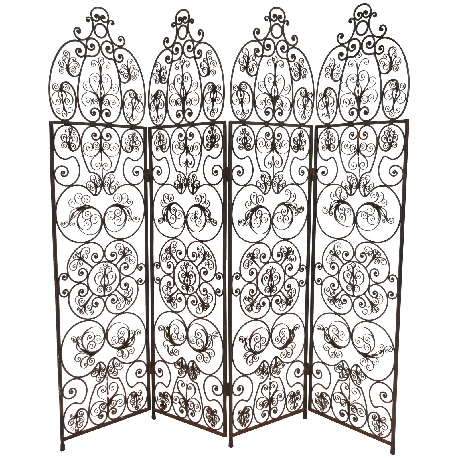 1960s Iron Scrolled Folding Screen: 4 panel iron scrolled folding screen. Condition: Alterations: Original Condition Unaltered Imperfections: Some Imperfections Condition Notes: Good Some loss of paint to screen. Some rust spots. Each p
