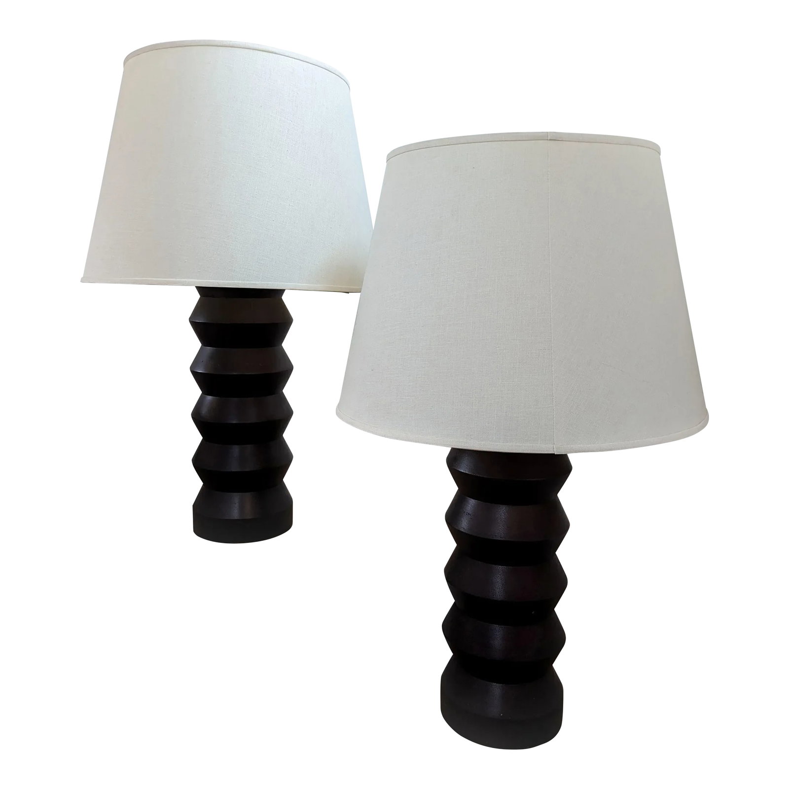Vintage 1960's Totem Table Lamps Dark Brown - Set of 2: Add a touch of sophistication to your space with these elegant table lamps. Featuring unique bases in a rich dark finish and topped with classic cream-colored shades, these lamps blend seamlessly