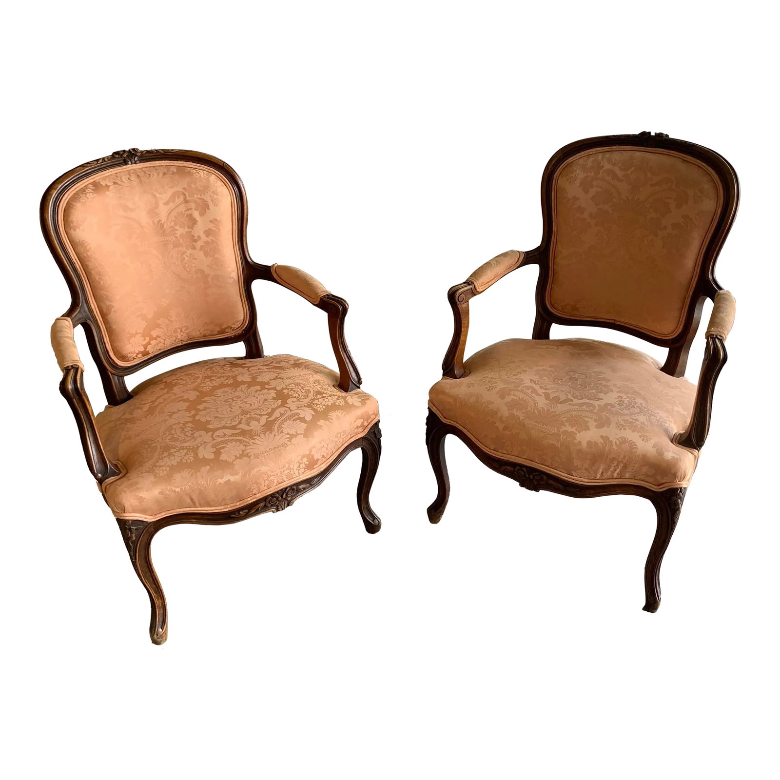 French Antique Carved Walnut Damask Louis XV Style Accent Fauteuil Arm Chair- a Pair: Offered is this pair of Circa 1910, French Louis XV style accent fauteuil armchairs. Hand carved wood floral motif on the crest, knees and apron of the chairs. Standing on cabriole legs. Set of 2 Cond