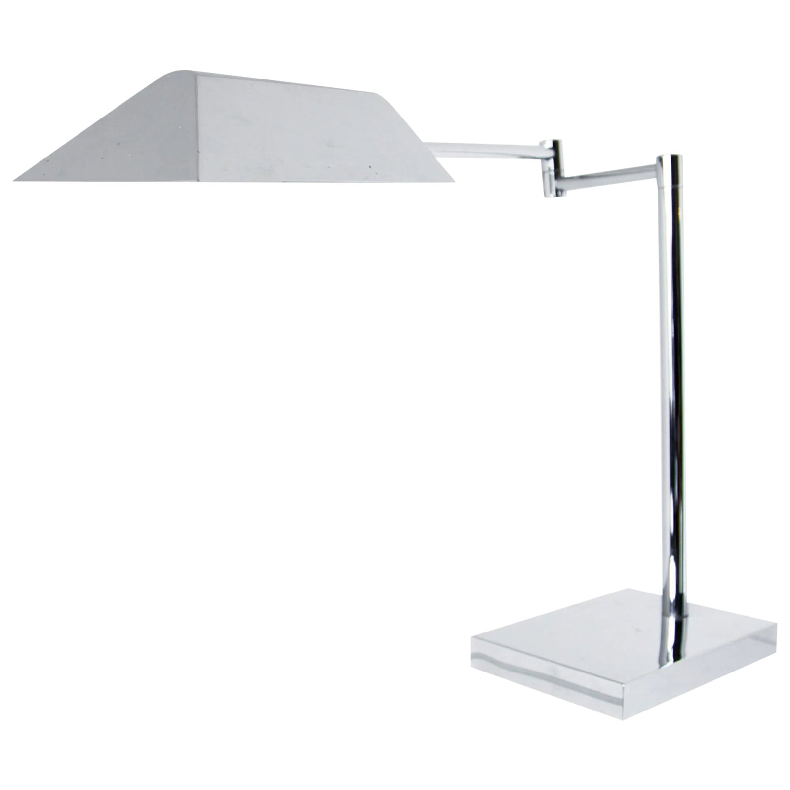 Koch & Lowy Chrome Desk Lamp: An elegant desk lamp in polished chrome by Koch & Lowy; the tent shade articulates on a ball and socket and further adjusts on a swing-arm. Condition: Alterations: Unknown Imperfections: Some Imperfec