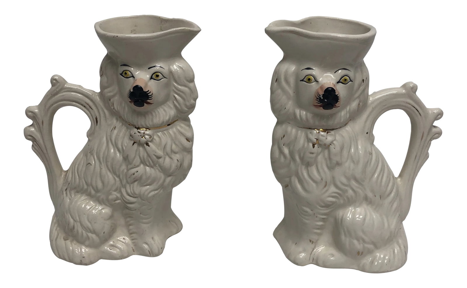 Antique English Staffordshire Spaniel Pitchers - a Pair: Unusual Antique English circa 1880 Staffordshire Spaniel pitchers with pouring "hats". Condition: Alterations: Original Condition Unaltered Imperfections: Some Imperfections Condition Notes: Age appro