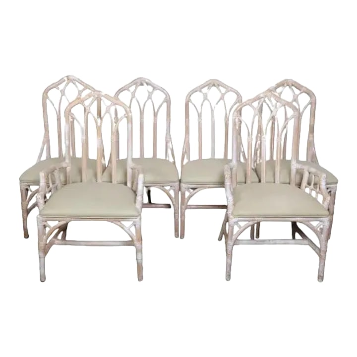 Vintage Cathedral Rattan Upholstered Dining Chairs - Set of 6: Bring a touch of vintage charm to your dining experience with this set of six Vintage Cathedral Rattan Upholstered Dining Chairs. Crafted with a classic Chippendale design, these chairs feature a