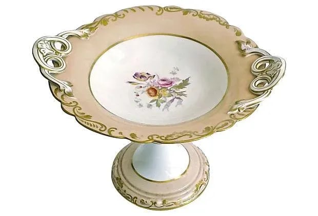Antique Porcelain Floral Compote: Antique; 19th century, English, porcelain, floral compote with scalloped edges and acanthus leaf handles. Hand-painted floral bouquet at center and gilt acanthus leaf design accents. Acanthus leaf des