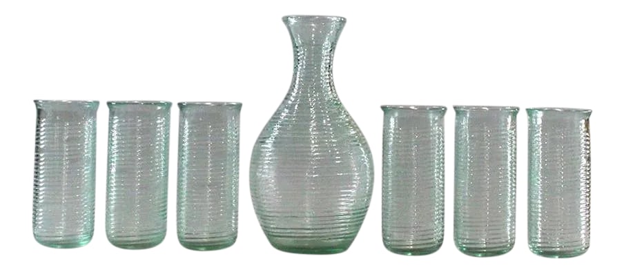Modern Italian Venician Green Glass Decanter and Glasses - Set of 7: Six Italian Venetian Glasses and Carafe C. 1950s. Glasses 5.75 x 2.75 in. Carafe 9.5 x 5 in. All marked A VE Italy Condition: Alterations: Original Condition Unaltered Imperfections: Some Imperfection
