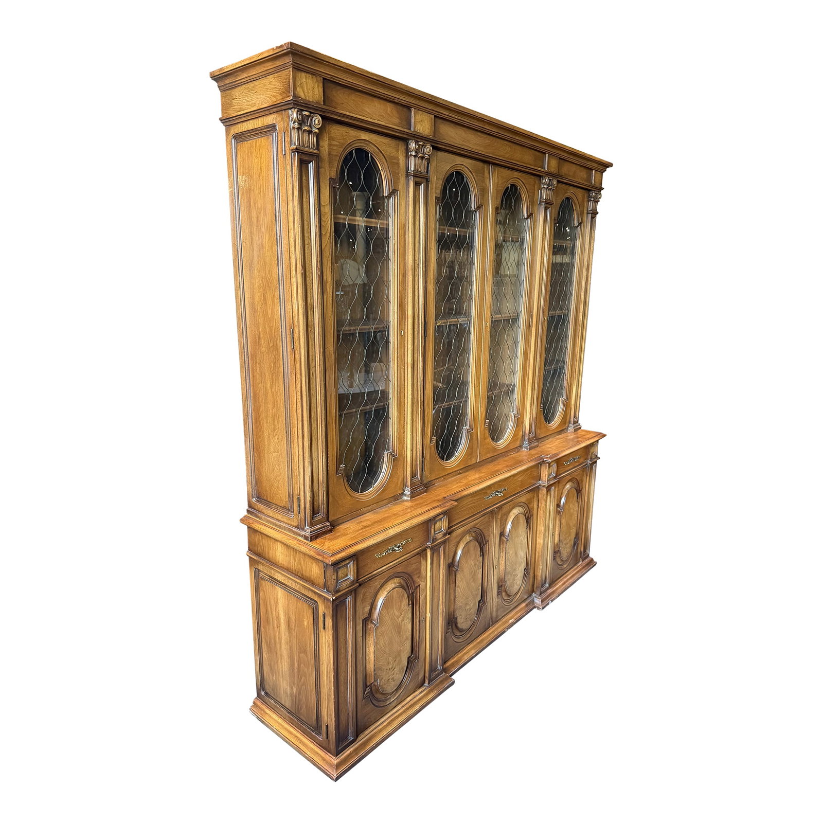 Karges Furniture Breakfront China Cabinet, Circa 1980s: An exceptional breakfront china cabinet attributed to Karges Furniture, circa 1980s, showcasing the brand's hallmark craftsmanship and refined neoclassical styling. This grand four-door cabinet