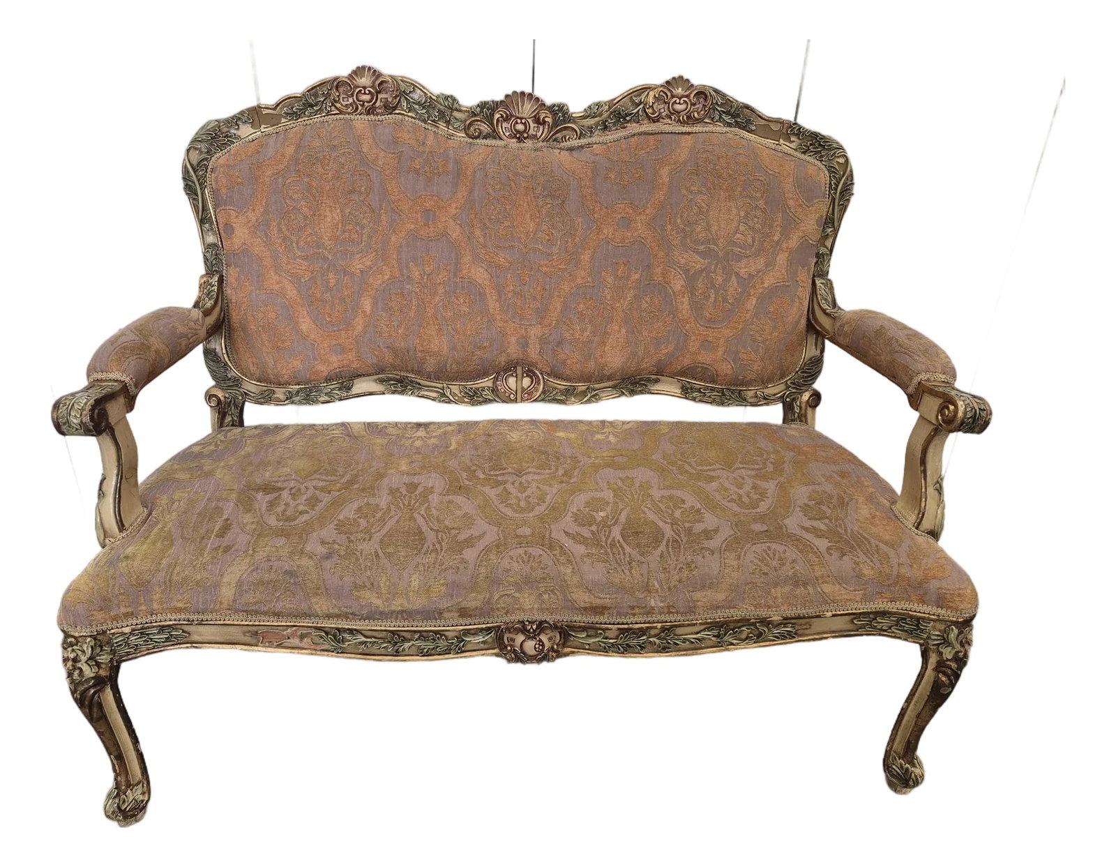Antique French-Style Carved Settee: Elegant antique French-style settee featuring an ornate carved wood frame with gilt, pink, and green accents. The piece showcases intricate floral and scroll detailing along the crest, arms, and cabri