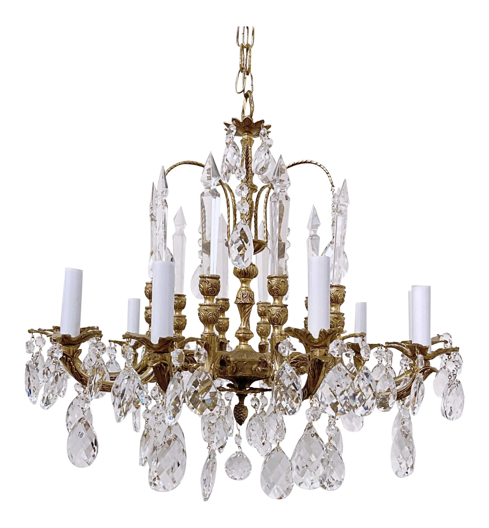 Vintage Early 20th Century Spanish Brass Chandelier With Glass Spears: Decorative vintage Spanish style brass chandelier with hand cut faceted glass spears and Swedish cut crystal prisms. it has 10 lights. #119 Condition: Alterations: Restored Imperfections: Some Imperfe