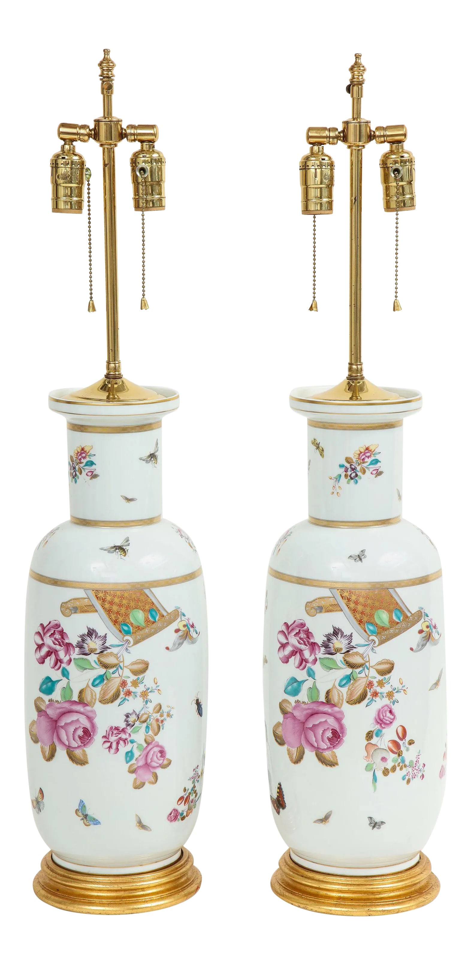 Porcelain Polychrome and Gilt Rouleau Vase Lamps - a Pair: Each decorated in the 18th century spirit with floral blossoms, butterflies and bees, and gilt banding, on a giltwood turned base. Fitted with brass sockets for two bulbs and adjustable rod to change 