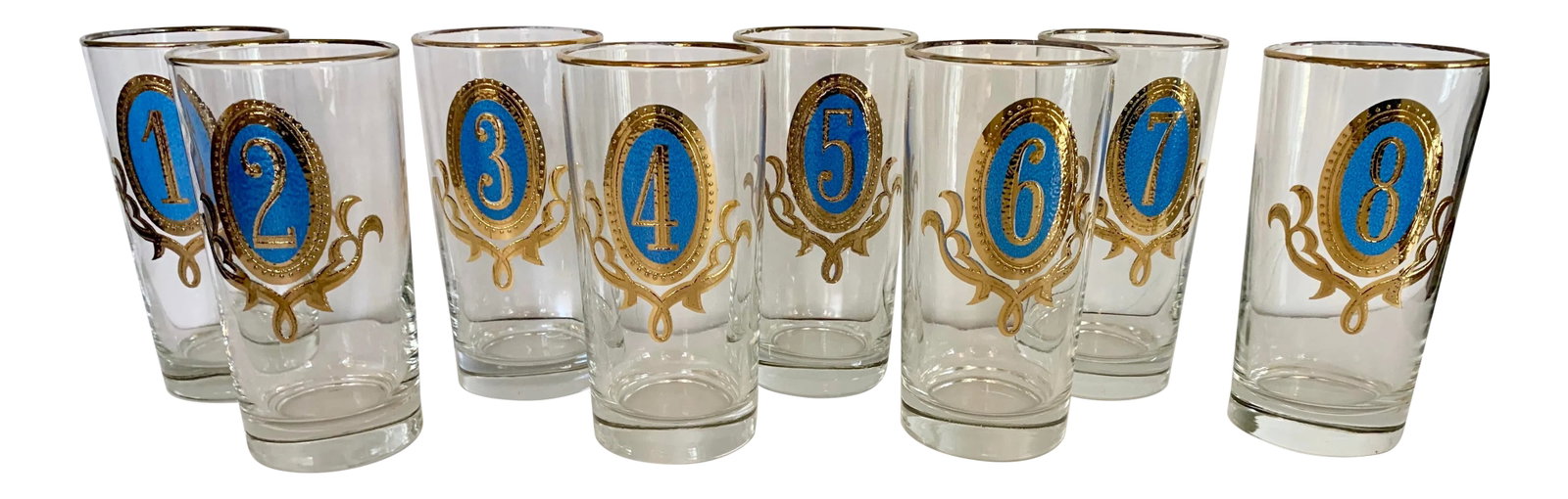 Numbered Glasses Blue and Gold - Set of 8: Never lose your cocktail at a party again! This set of 8 Mid-Century tumblers are numbered 1 through 8. Thin gold rim. Heavy base. Condition: Alterations: Original Condition Unaltered Imperfections:
