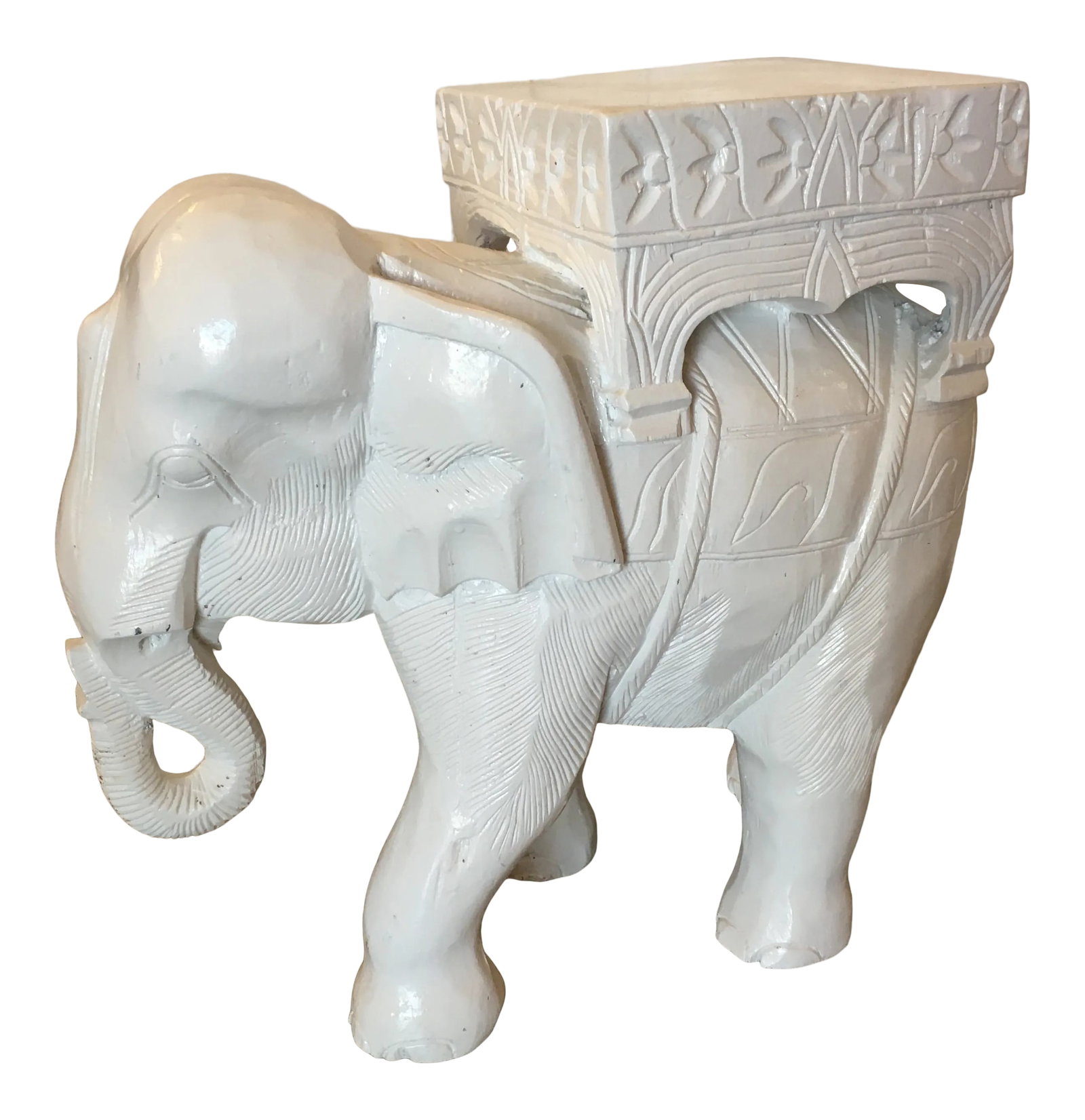 Hollywood Regency White Carved Wood Elephant Side Table/ Stool: Wonderful hand carved elephant side table or stool. It's carved from one solid piece of wood and painted in gloss white. It's great for extra seating indoors and it's a sculpture when not being used.
