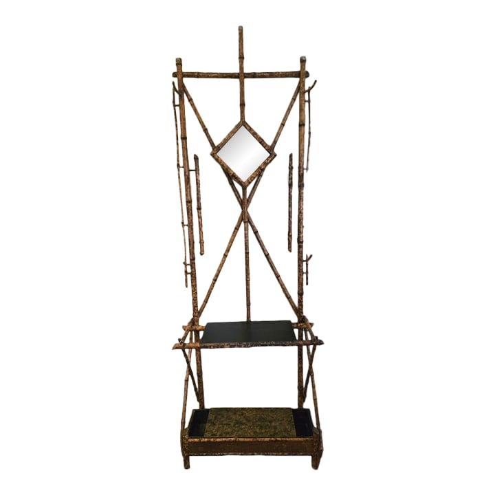 1920s Bamboo Hall Tree: This is an antique English bamboo Hall Tree form the late 19th century. This has a diamond shaped beveled mirror and four hooks as well as two surfaces. The bottom shelf lifts off with space for hidde