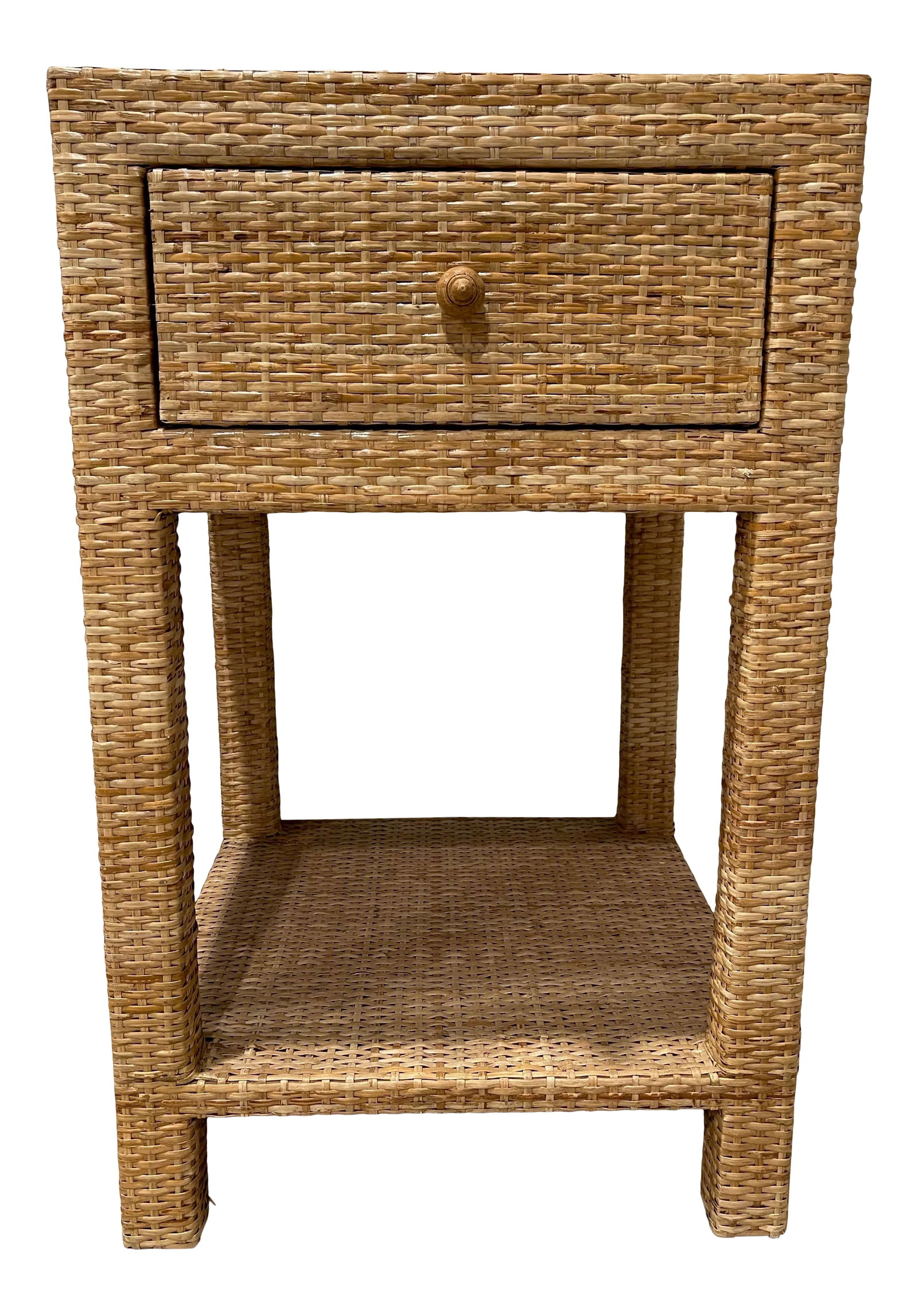 Made Goods Rattan Single Nightstand: A tightly wrapped, natural peeled rattan frame complements the natural, peeled rattan top, side, and single shelf. The soft-close drawer is finished with a wood interior and carved wood knob.