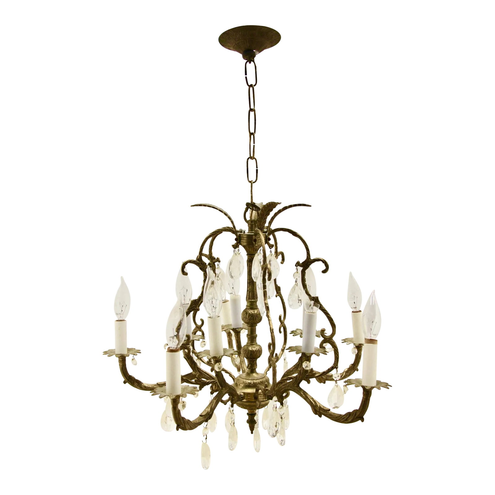 1950s Traditional Brass and Crystal 5 Arm Chandelier: Lovely brass and crystal chandelier. Features 5 arms (accepts ten 25watt max candelabra base bulbs) made of brass and a lovely cage structure with acanthus leaves at crown. Good vintage condition; one