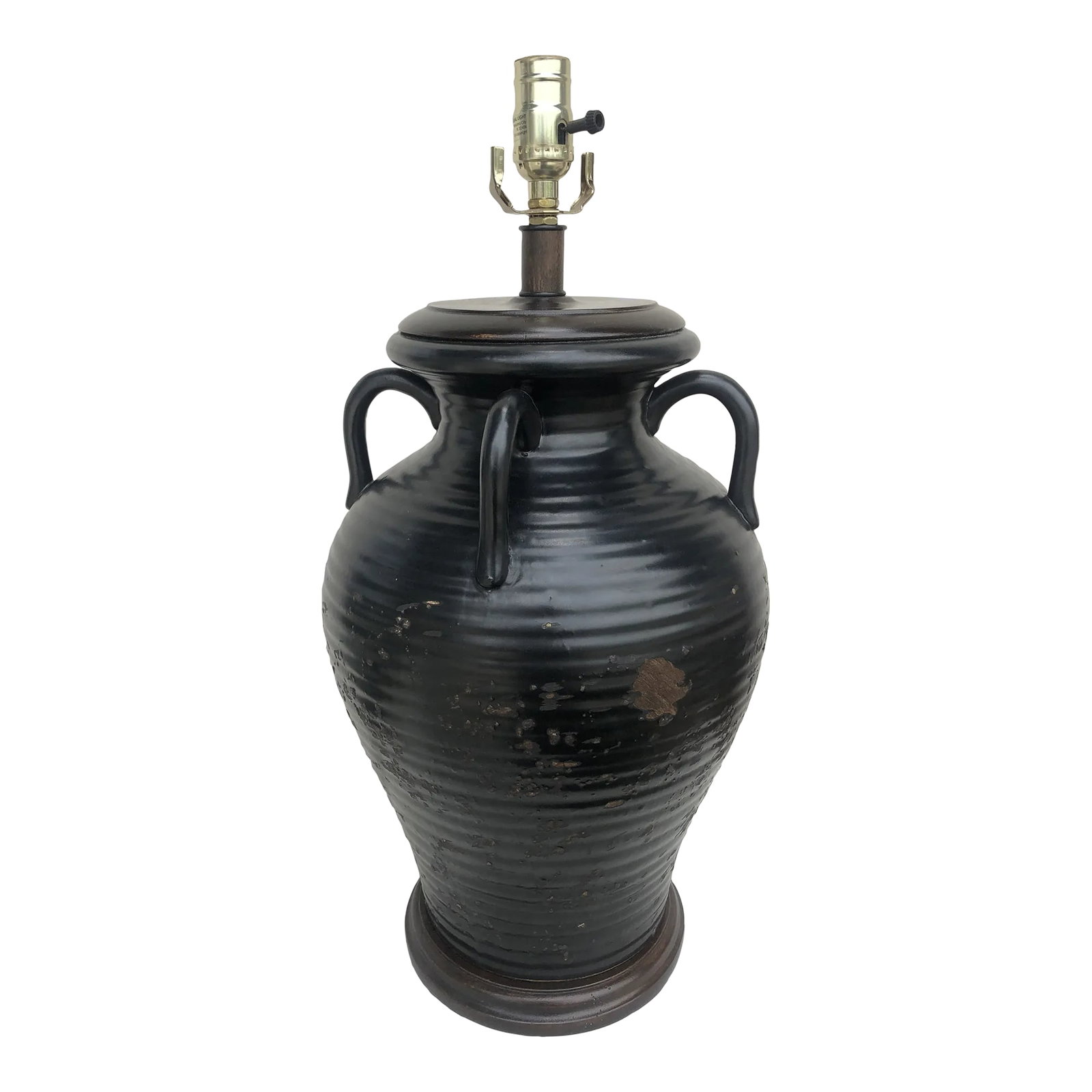 The Natural Light Olivaris Brown Tuscan Table Lamp: The Olivaris table lamp offers lovely design elements in a well-executed package. The base is a finely crafted pottery jug complete with carrying hooks near the top and a wood base. A nuanced, weather