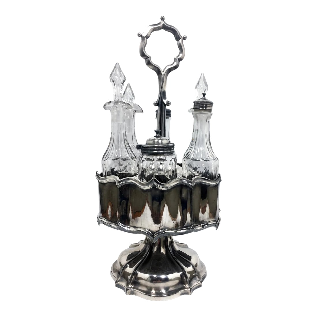 19th Century Cut Crystal & Silver Victorian Cruet Set- 6 Pieces: This antique silver condiment caddy dates from circa 1895 based on the Art Nouveau-influenced silhouette and sinuous lines. Each vessel is made of cut crystal with either a silver cap or cut crystal s
