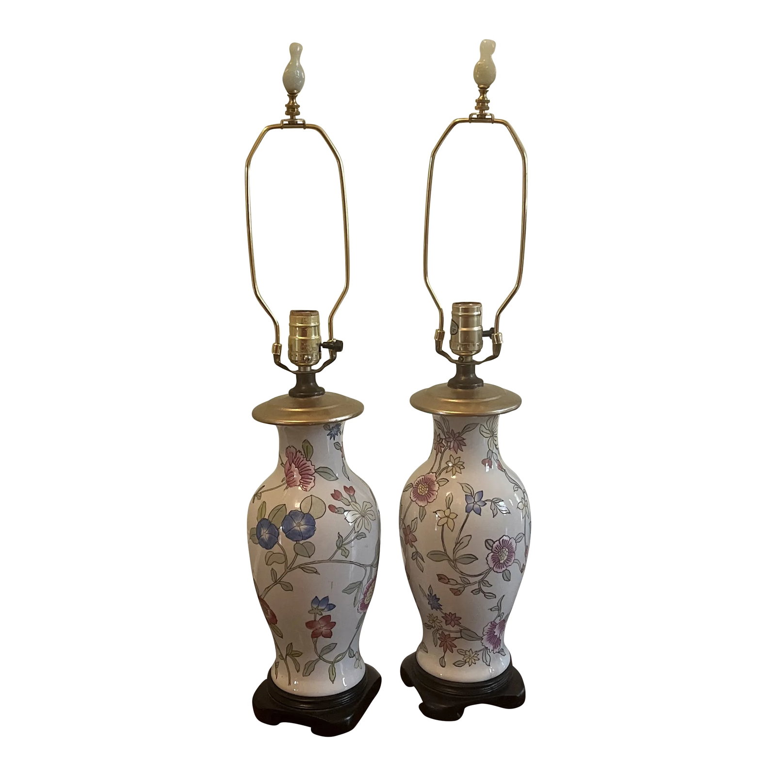 1950s Embossed Floral Table Lamps - a Pair: Beautiful floral tables lamps in great condition. The floral pattern is embossed into the ceramic. Lovely chinoiserie pale jade finials. Harps and finials included. Shipped with finial detached. Condi