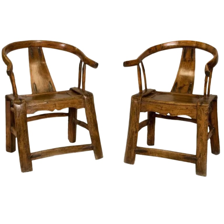 19th Century Chinese Yoke Back Chairs - A Pair: Pair of Chinese yoke back or scholar chairs made in Chinese elmwood. DATE OF MANUFACTURE 1750s - 1850s. SEAT HEIGHT 18.5 in. (47 cm). Condition: Alterations: Original Condition Unaltered