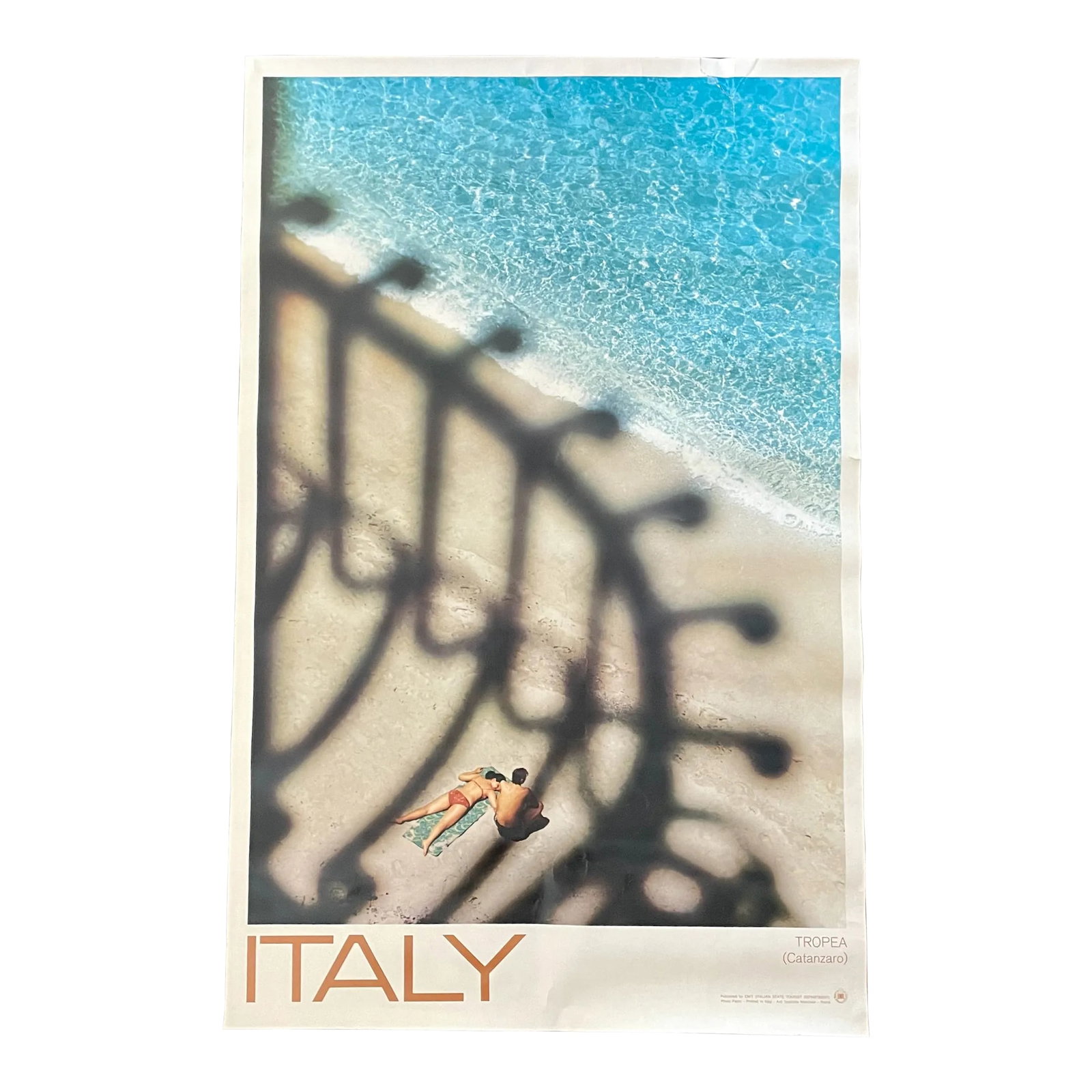 Vintage Authentic Italy Tourism Poster - Est 1970s - Enit Italian State Tourism: Ah-mazing genuine vintage "Italy" poster. Featuring the words "Italy" and "Tropea (Catanzaro)" and a chic photograph of a duo sunbathing on a bright, blue-watered beach with gorgeous shadows.