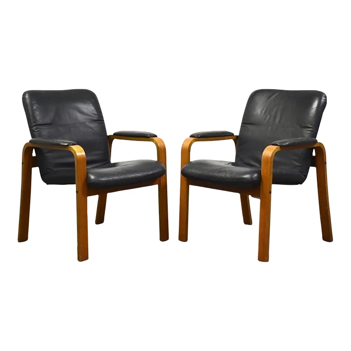 Ekornes Blue Leather and Teak Lounge Chairs - a Pair: A pair of mid century modern teak bent wood lounge chairs with blue leather upholstry made by Ekornes Stressless. Seat height is 18". 26.75" wide. 28.5" deep. 34" tall. Condition: Alterations: Origina