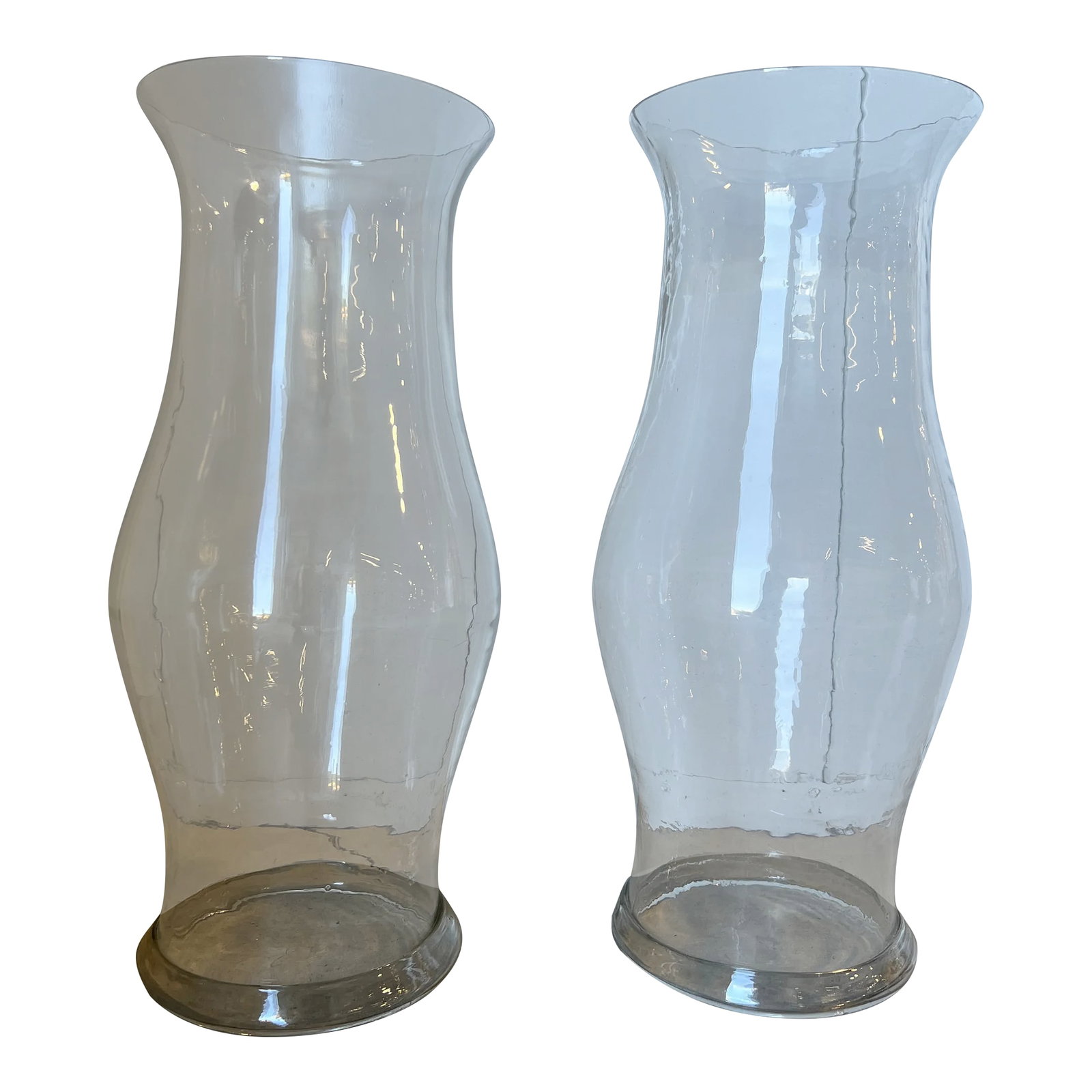 Pair, Monumental 19th Century American Blown Glass Hurricane Candle Shades 22.5": American, mid 19th century. A pair of monumental blown glass hurricane shades in colorless glass. Each with tapering form and folded foot rims. Provenance: From a Little Compton Rhode Island Estate.