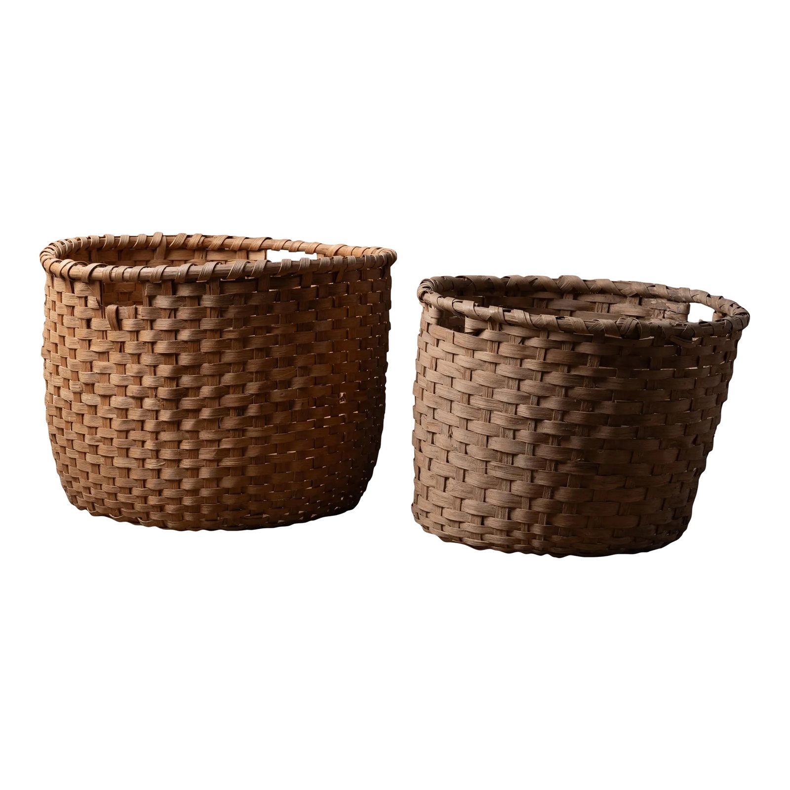 South Georgia Cotton Picking Baskets - a Pair: A pair of south Georgia plantation split oak cotton picking baskets, c.1900. largest: 24 1/2 inches wide by 23 3/4 inches deep by 18 3/4 inches tall smaller: 22 inches wide by 22 inches deep by 16