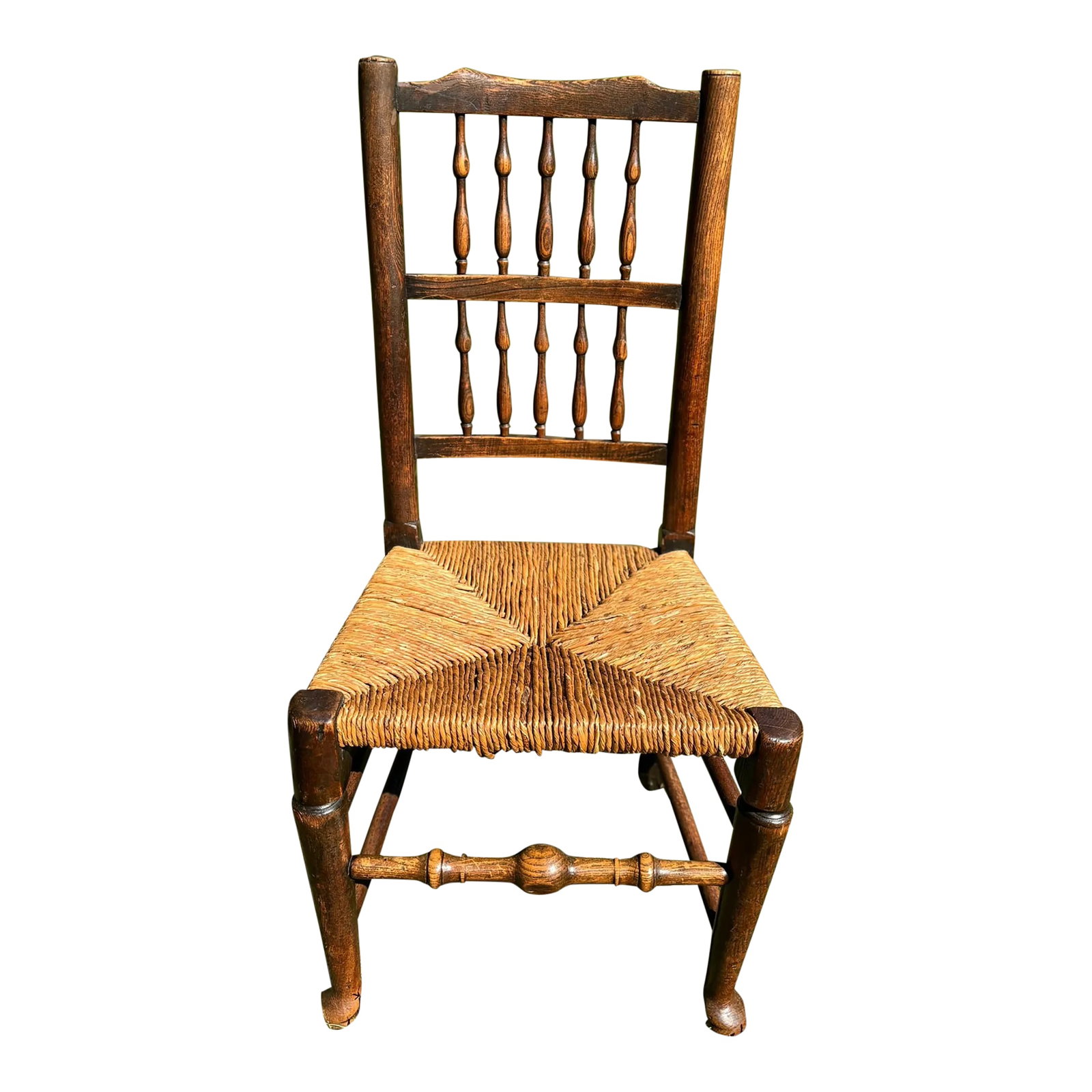 19th Century Beech Spindleback Chair: This old survivor, which likely hales from Lancashire, features a traditional spindleback design, characterized by its elegant backrest composed of vertical spindles. The frame is beech, and