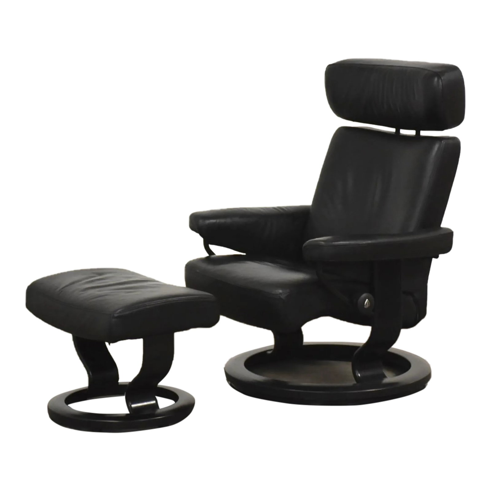 1960s Black Leather Ekornes Stressless Recliner and Ottoman: A modern black leather reclining lounge chair and ottoman made by Ekornes Stressless. Minor discoloring in the seat shown in photos. We believe is a size small. Seat height is 16". Ottoman is 21.25"