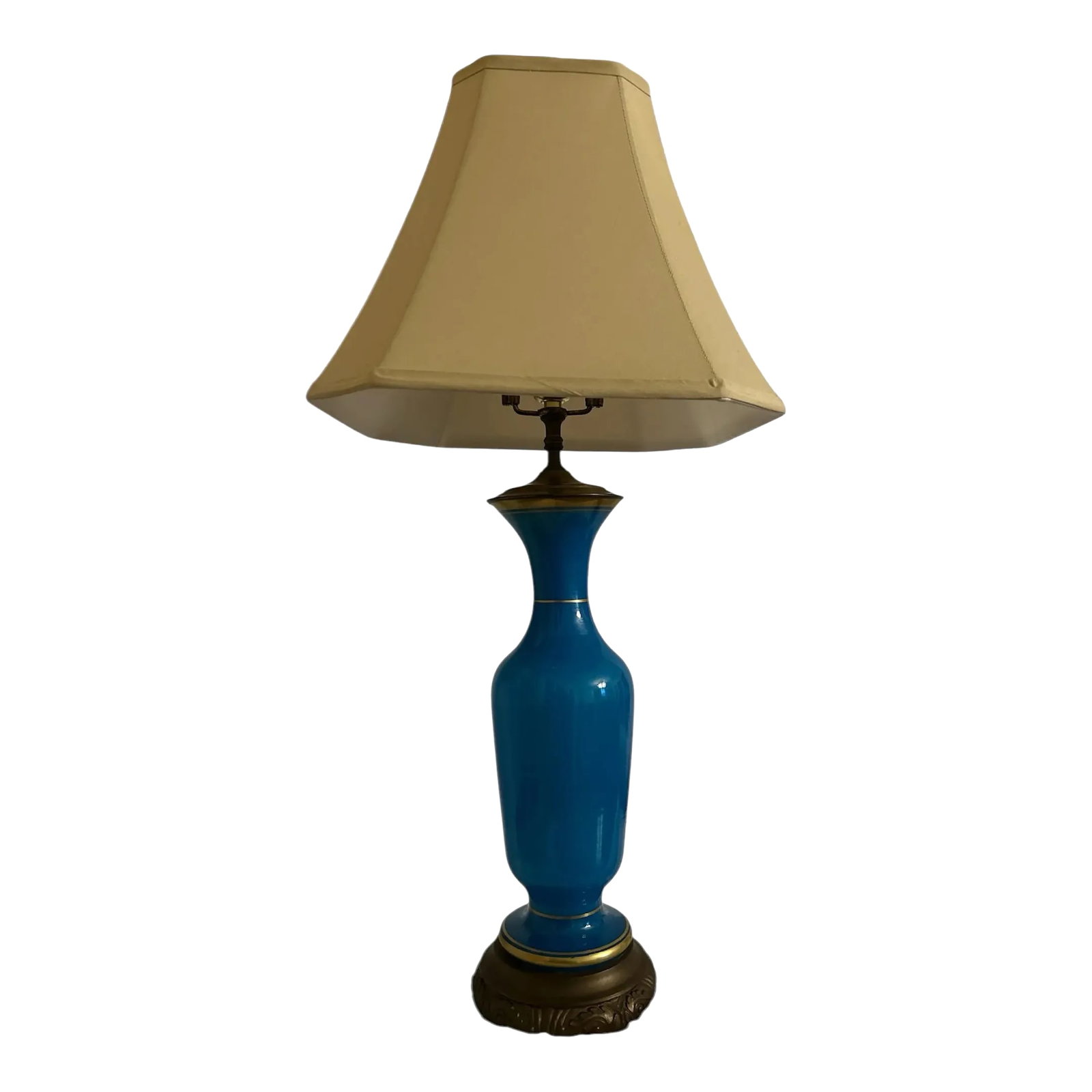 Antique Blue Opaline Glass Lamp: Beautiful blue glass lamp. It is striped with gold at the top and bottom. It sits on an ornate metal base. It has an unusual harp and lovely soft gold color octagon shape silk shade. The bottom of