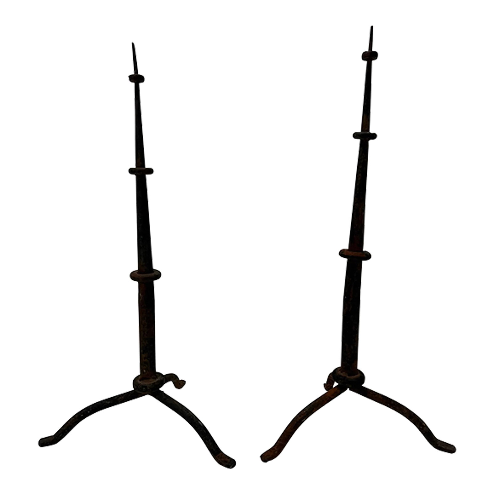 Pair, Antique Spanish Colonial Style Iron Prickets: This pair of Spanish Colonial-style iron prickets, dating from the early 20th century or possibly 19th century, is a striking example of hand-forged craftsmanship from a bygone era. Crafted in the tra