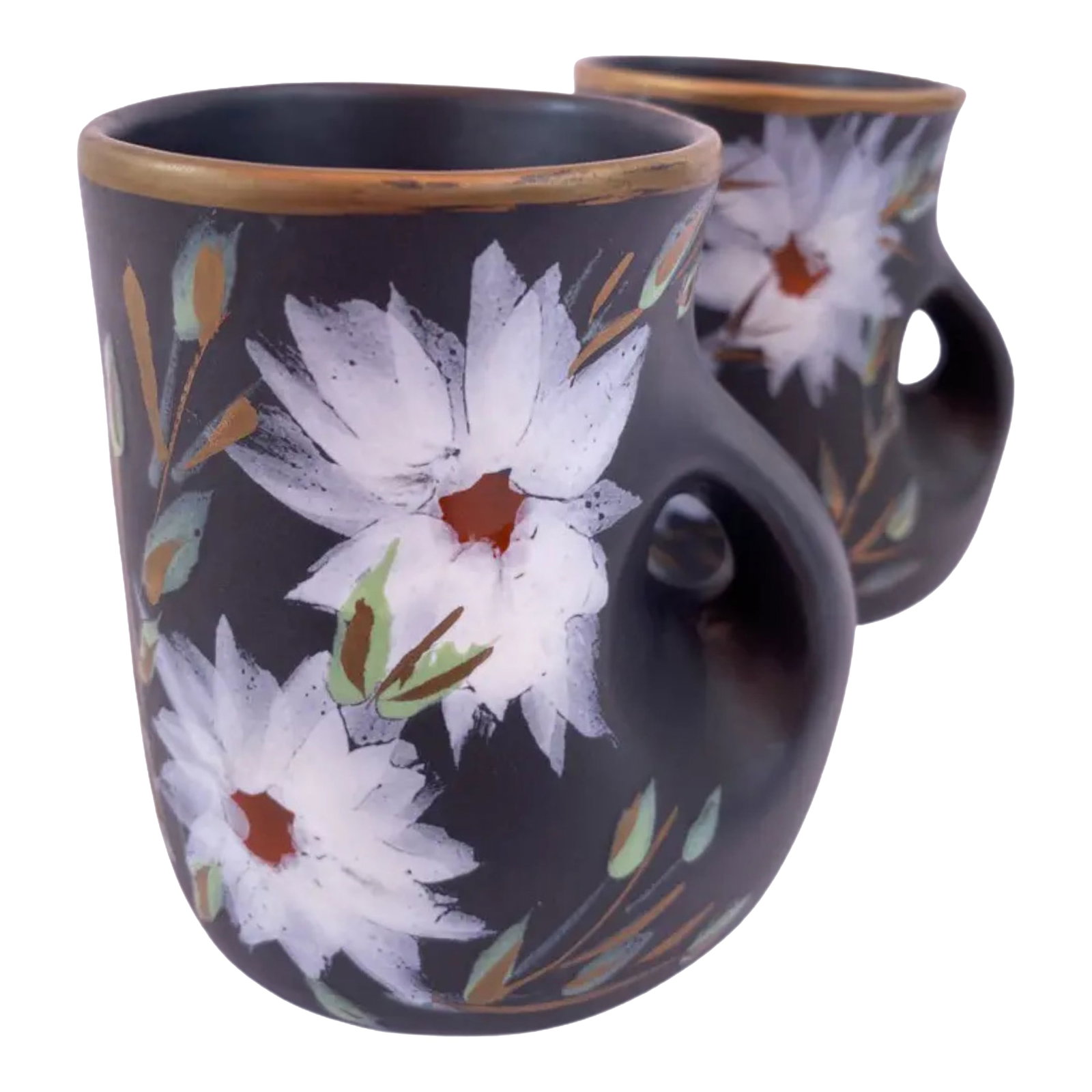 Mid-Century Vallauris Black White Floral Blossoms Terracotta Mugs- A Pair: This set of Vallauris terracotta mugs embodies the enduring ceramic legacy of Vallauris, a town nestled on the French Riviera with a pottery heritage tracing back to Roman times. While its early