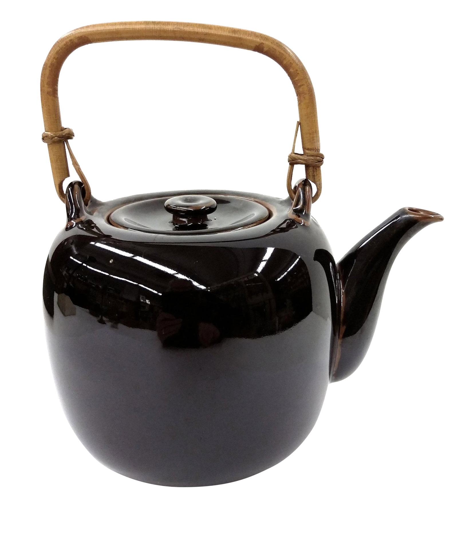 Hand Thrown Artist Glazed Teapot: A beautiful work of art indeed! This lovely deep brown double glazed teapot is a joy to look at. The bamboo handle is purposely slightly slanted towards the spout to make handling the pot much easier.