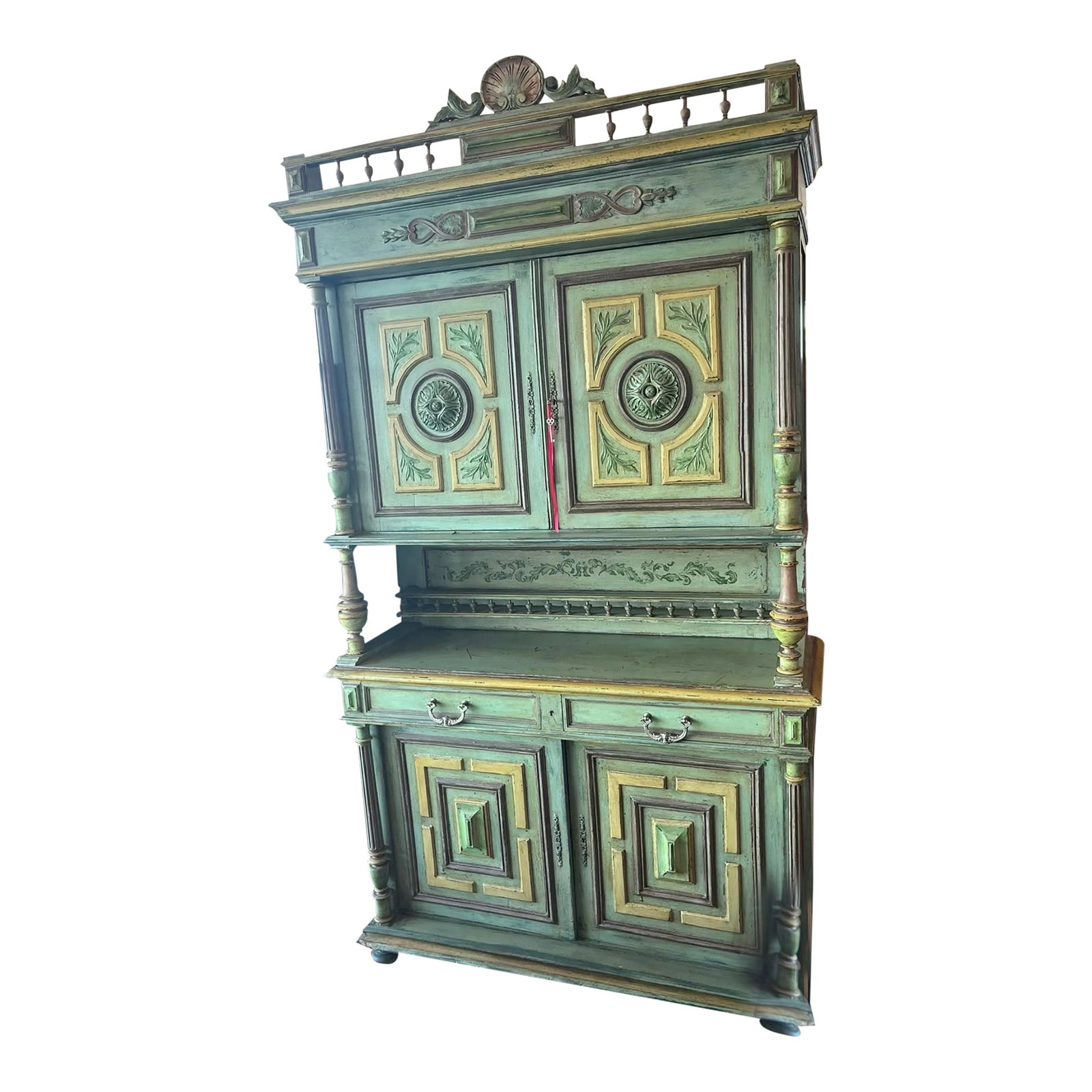 18th Century French Renaissance-Style Buffet a Deux Corps in Walnut: A Belle Epoque French buffet a deux corps in a medium, green colored walnut. This very beautiful Renaissance-style buffet features carvings with carved moldings Turned columns separate the top