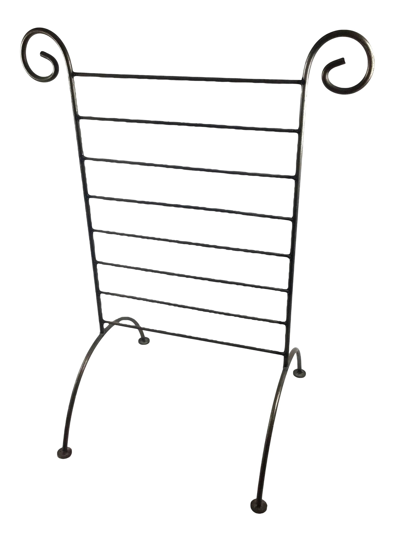 Vintage 1950s Bronze Magazine Rack: Simple yet very elegant. This sturdy and stable magazine rack is from the 50's. Use it for many things including towels, a matchbook collection or whatever you can hang on it. An investment piece inde