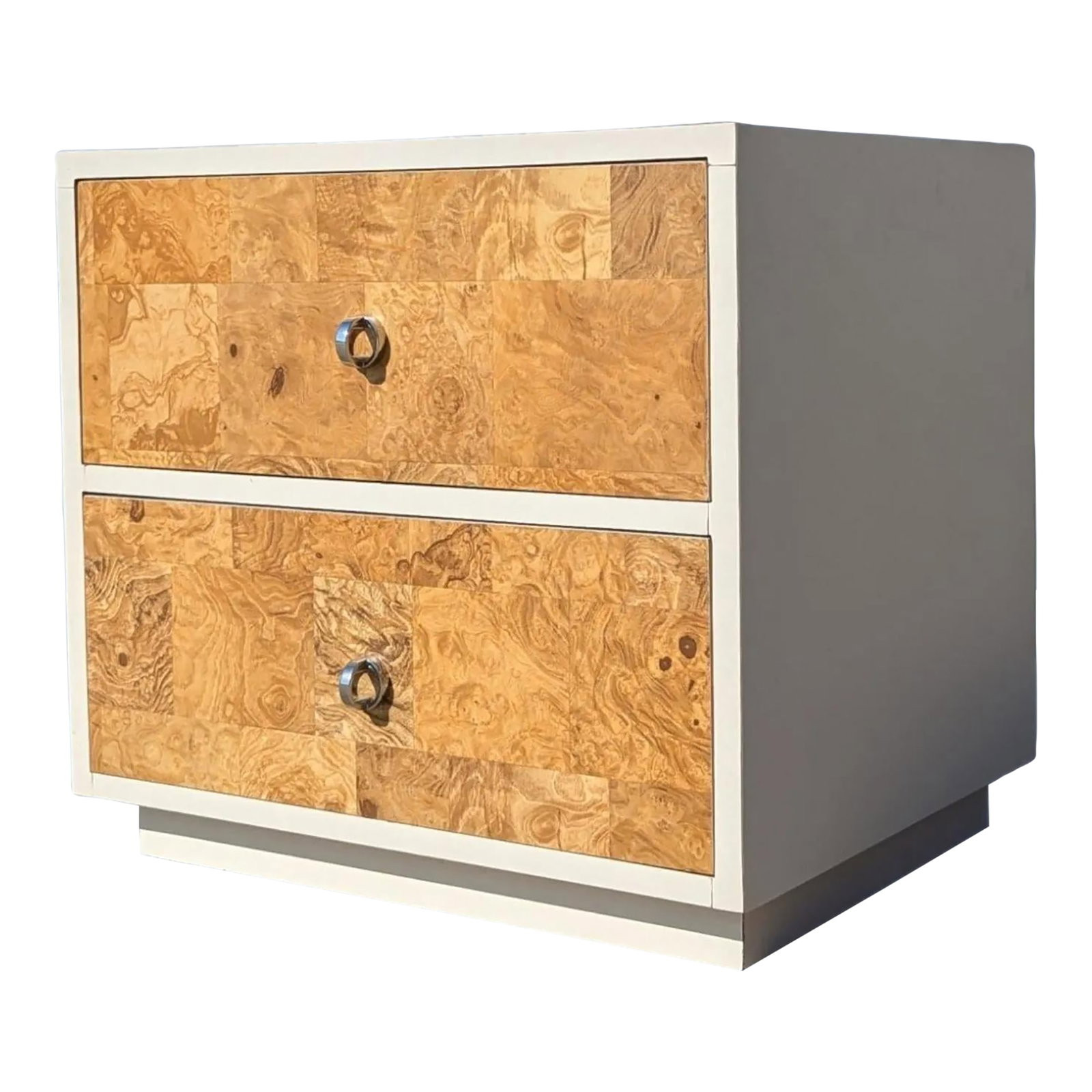 1970s Faux-Burl Laminate Nightstand With Chrome Pulls: A compact vintage nightstand from the 1970s featuring a faux-burl laminate finish and streamlined chrome pulls. The figured surface gives the piece visual depth, while the restrained hardware and