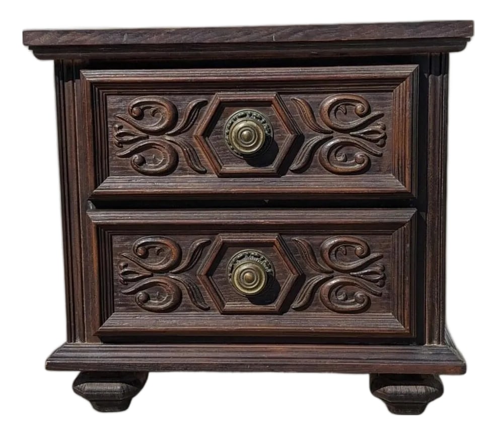 Vintage Spanish Gothic Revival Nightstand Ornate Carved Wood End Table, 1970s: Bring timeless design into your home with this 1970s Spanish Revival nightstand in dark carved wood. Design Highlights: A prime example of 1970s Spanish Gothic Revival style, this piece features
