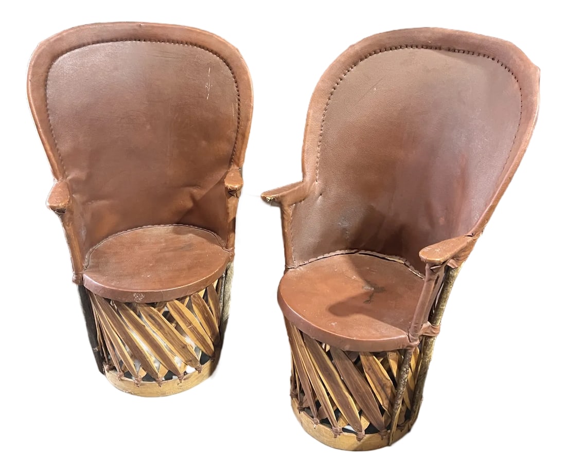 Vintage Pair of Wooden and Leather Equipale Chairs: Up for consideration is a beautiful vintage pair of leather and wooden equipale chairs. This would look lovely in your home and it is a perfect conversation starter for your guests. This piece is also